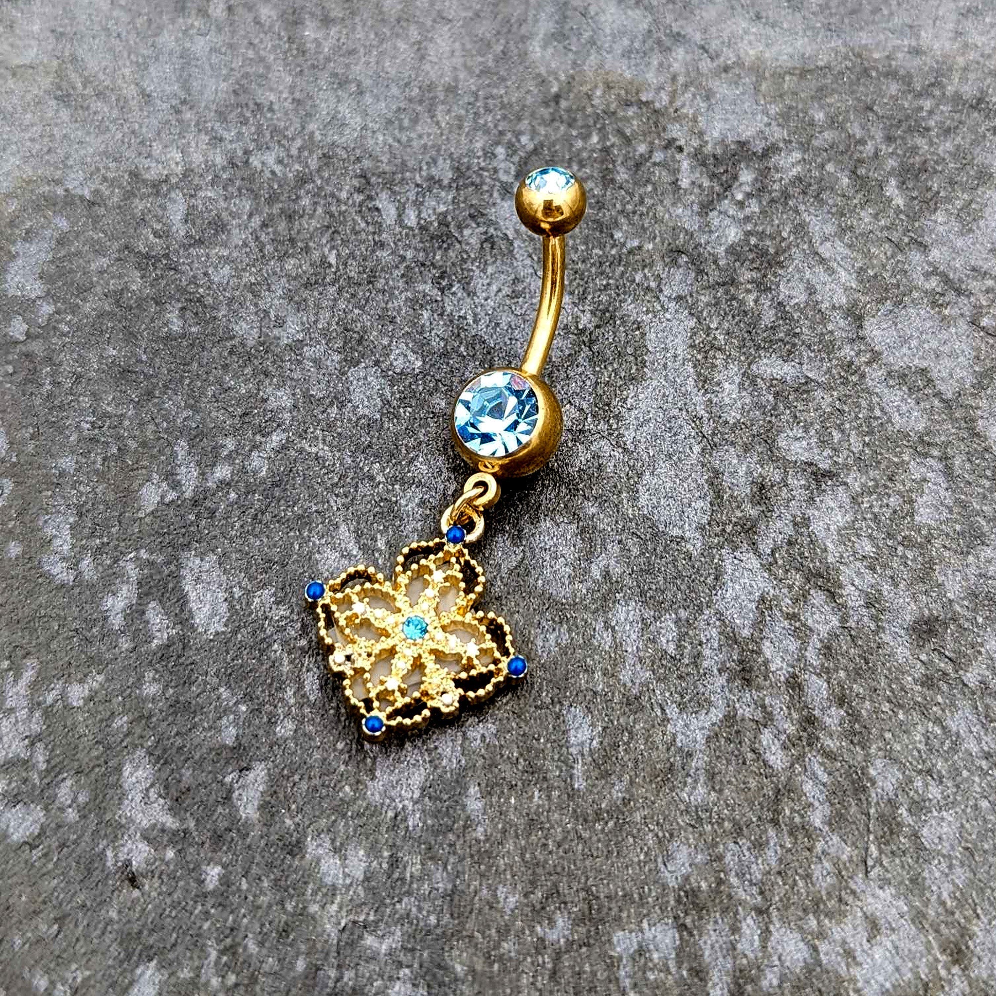 BodyCandy Blue Gem Gold Tone Texture Emblem Dangle Belly Ring — side view