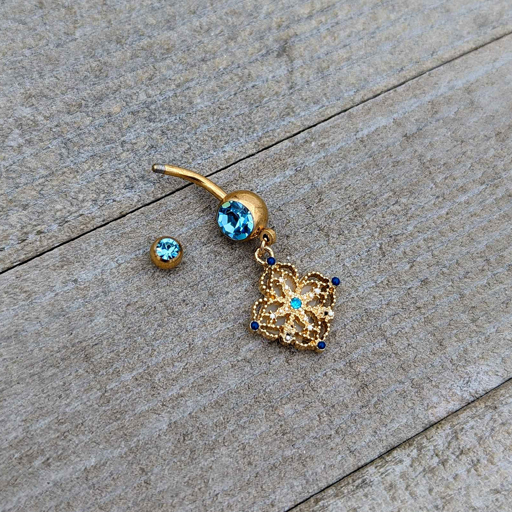 BodyCandy Blue Gem Gold Tone Texture Emblem Dangle Belly Ring — alternative angle