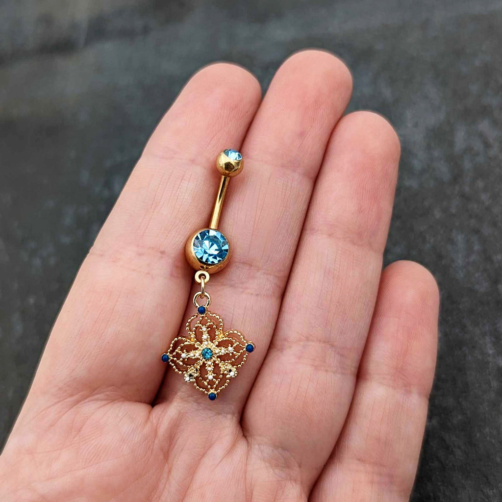 BodyCandy Blue Gem Gold Tone Texture Emblem Dangle Belly Ring — size reference