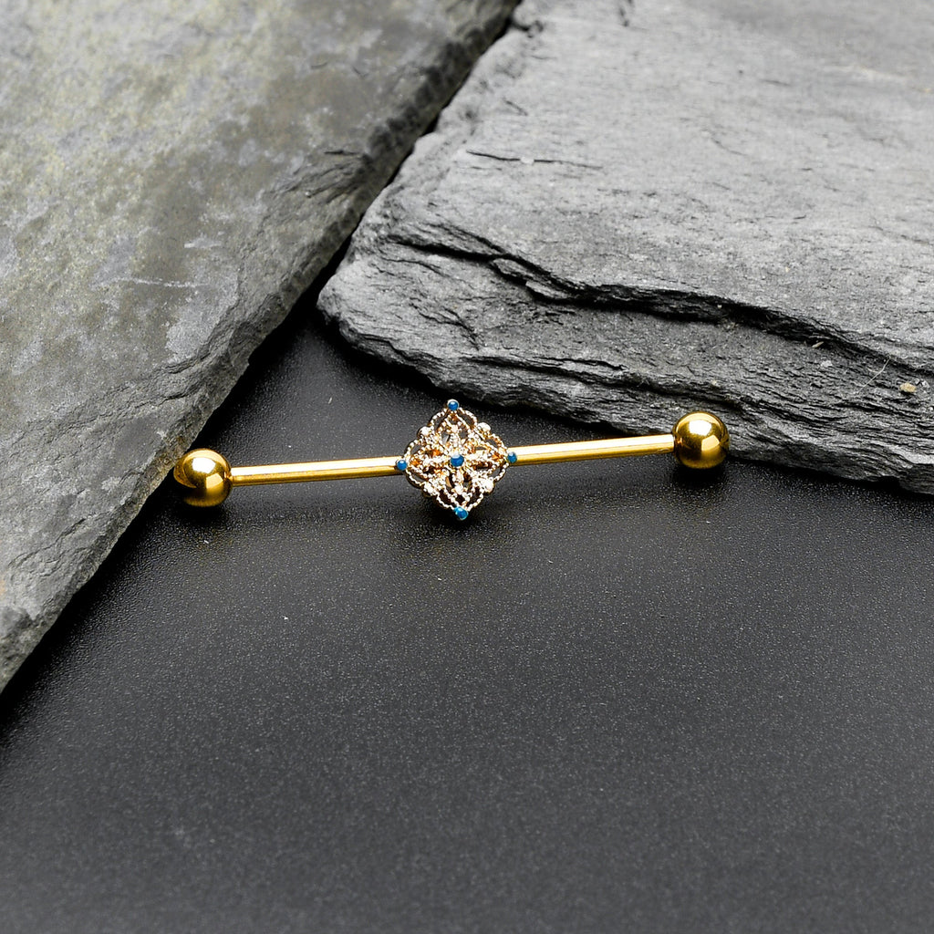 BodyCandy 14G Blue Gem Gold Tone Texture Emblem Industrial Barbell 38mm — side view