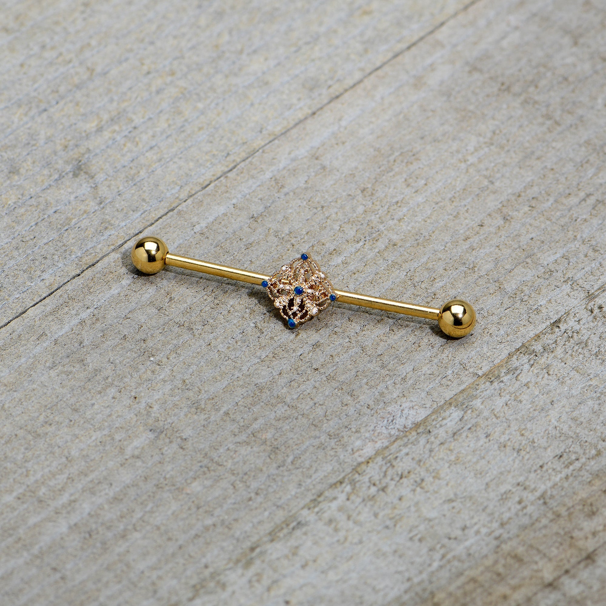BodyCandy 14G Blue Gem Gold Tone Texture Emblem Industrial Barbell 38mm — back view