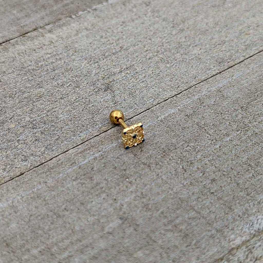 BodyCandy 16G 1/4 Blue Gem Gold Tone Lacy Rhombus Cartilage Tragus Earring — in-use photo