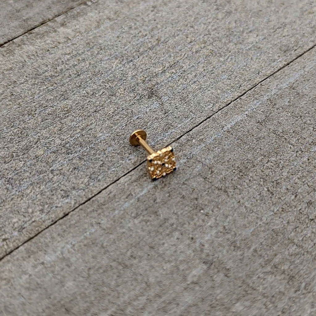 BodyCandy 16G 5/16 Blue Gem Gold Tone Lacy Rhombus Labret Monroe Tragus — in-use photo