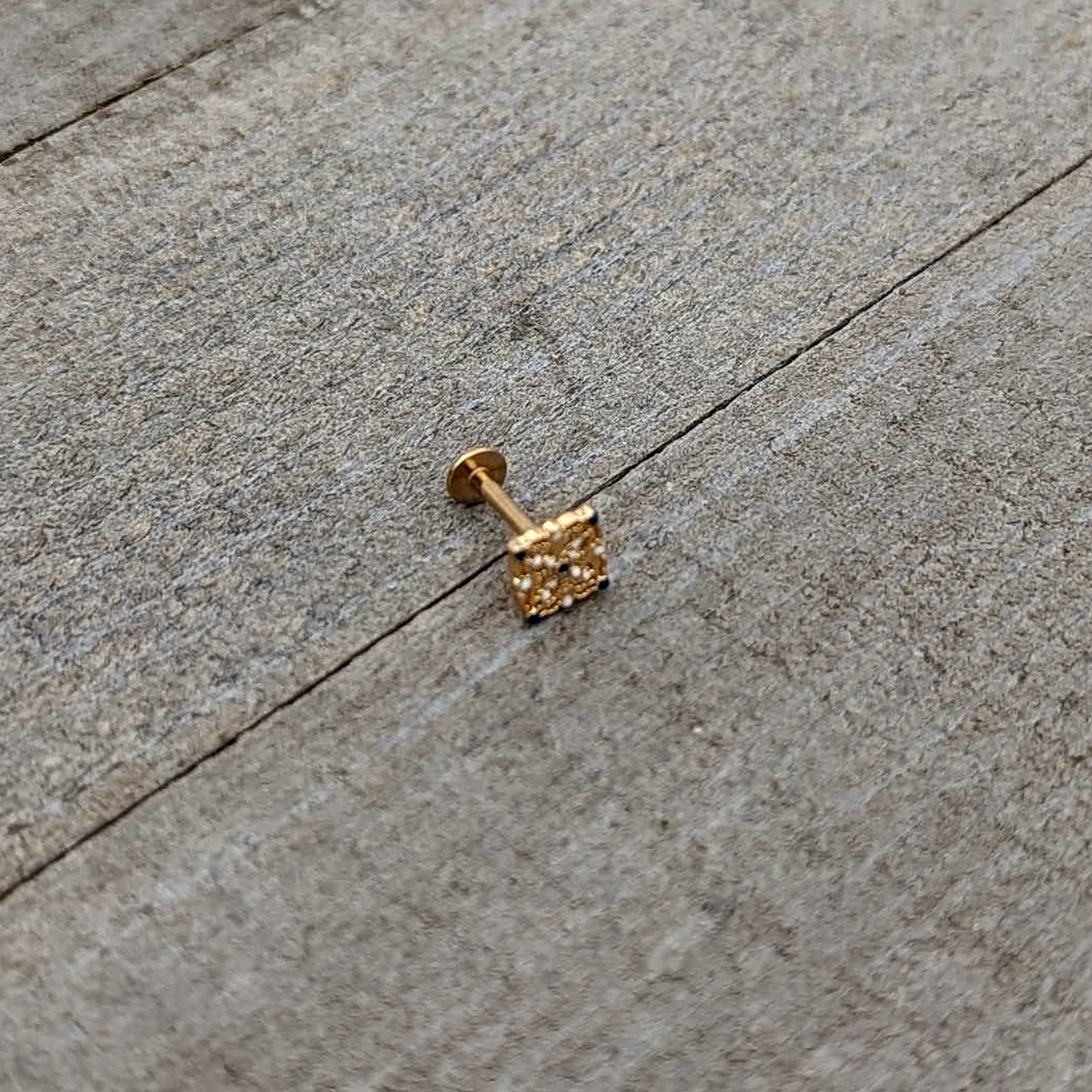 BodyCandy 16G 5/16 Blue Gem Gold Tone Lacy Rhombus Labret Monroe Tragus — in-use photo