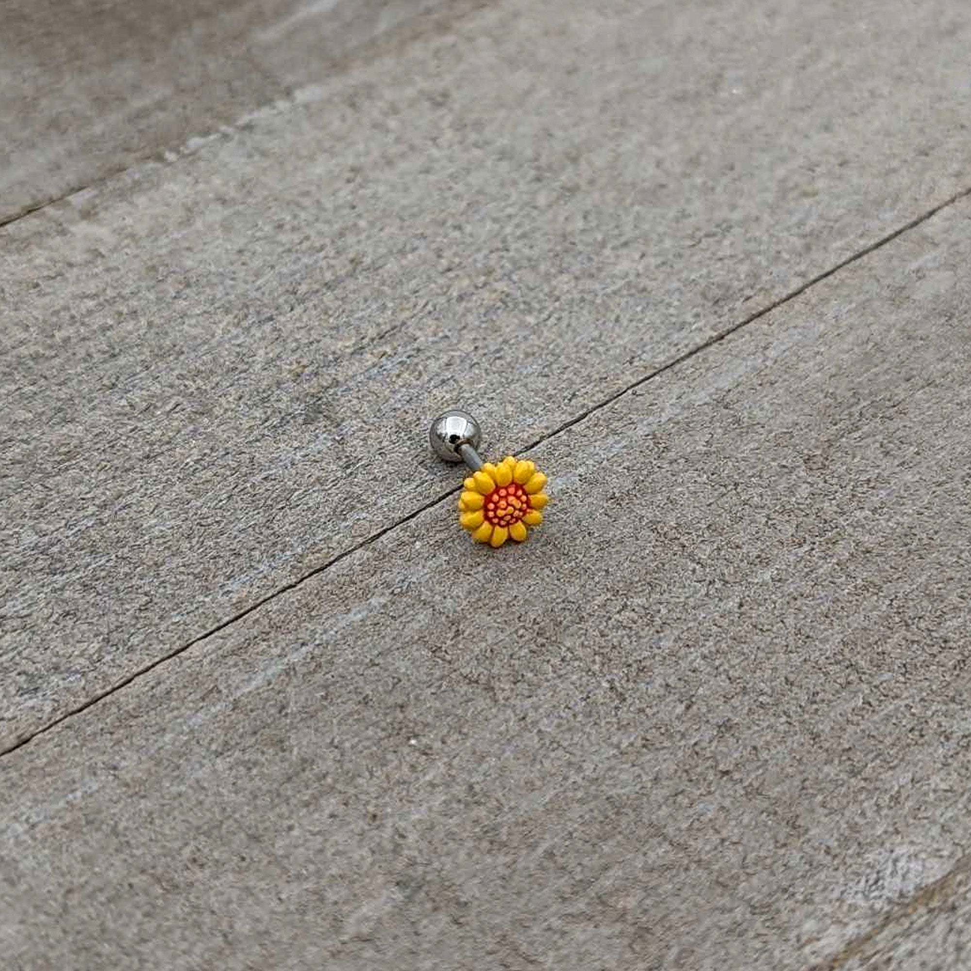 BodyCandy 16G 1/4 Happy Sunflower Cartilage Tragus Earring — in-use photo