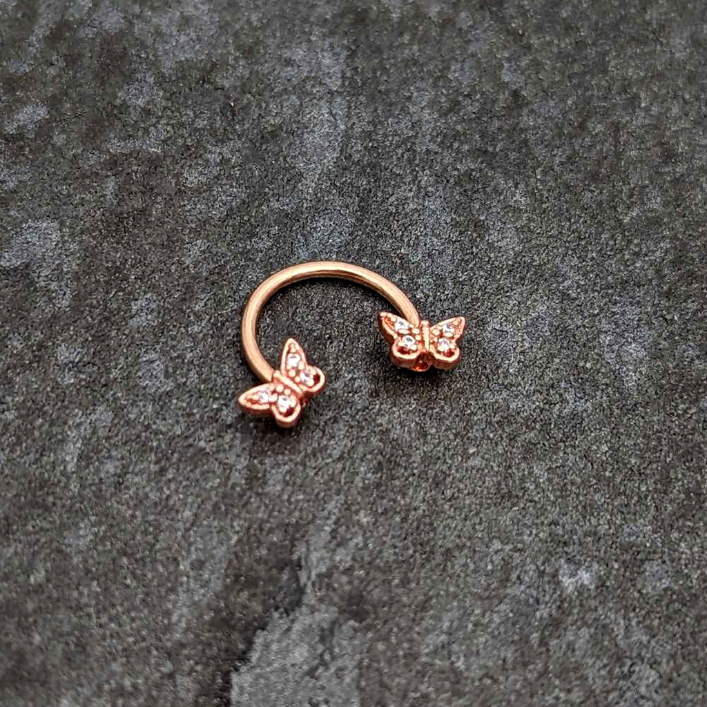 BodyCandy 16G 3/8 Clear Gem Rosy Tone Butterfly Horseshoe Circular Barbell — side view