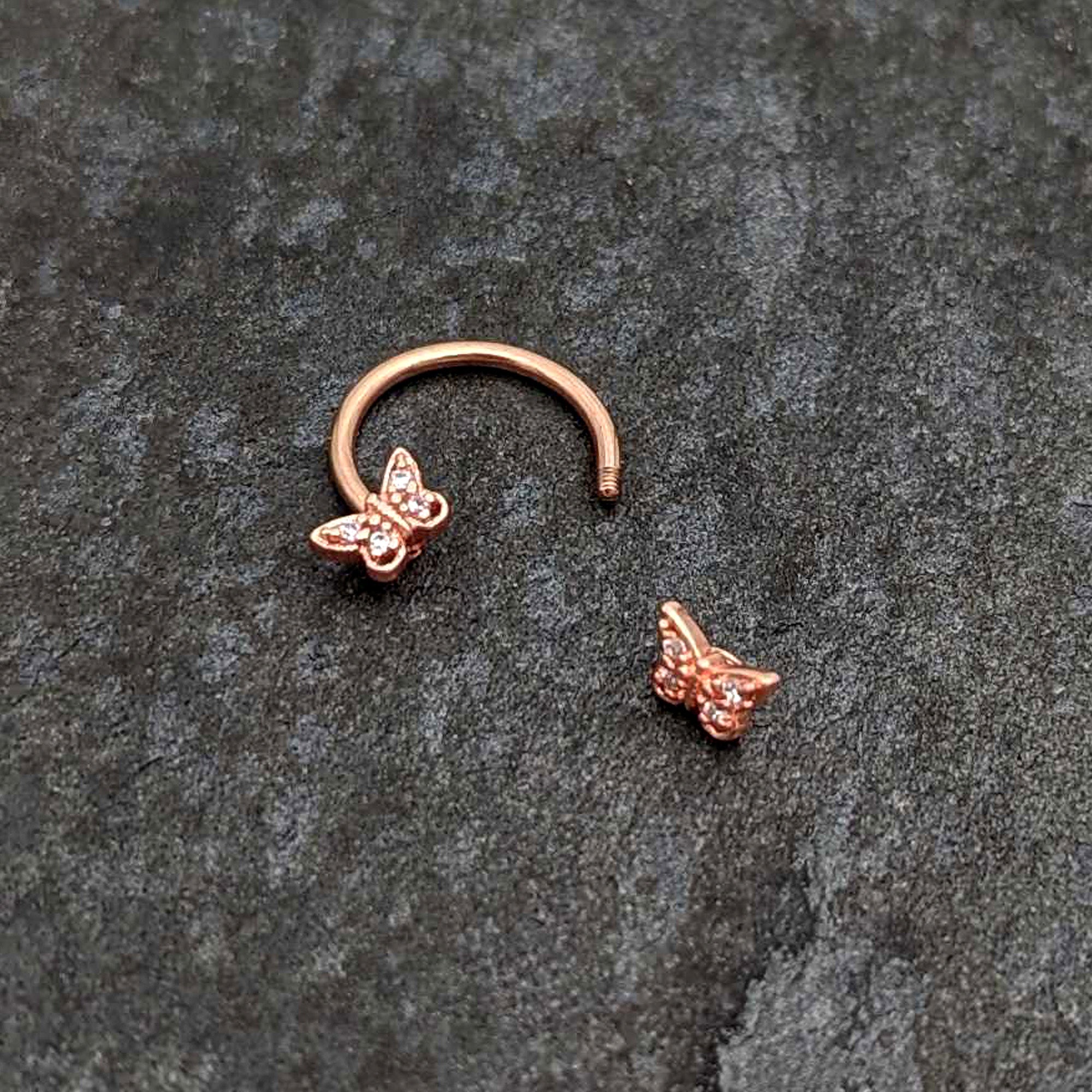 BodyCandy 16G 3/8 Clear Gem Rosy Tone Butterfly Horseshoe Circular Barbell — back view