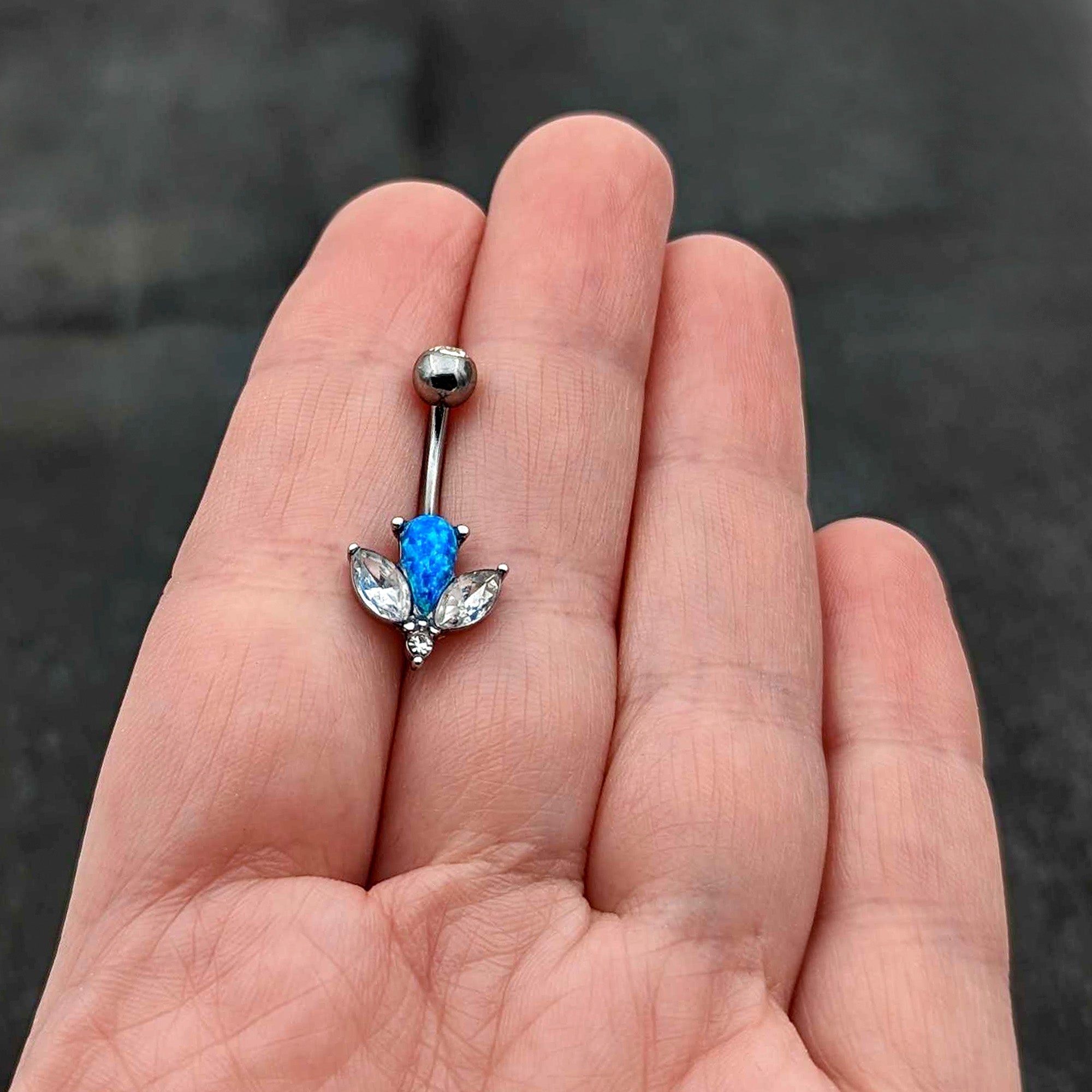 BodyCandy Blue Synthetic Opal Style Flower Belly Ring — in-use photo