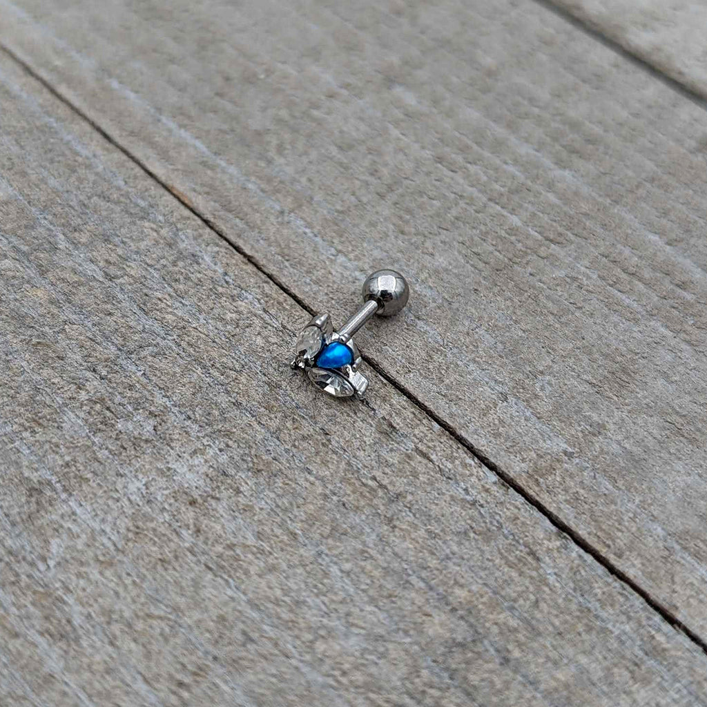 BodyCandy 16G 1/4 Blue Synthetic Opal Style Flower Cartilage Tragus Earring — in-use photo