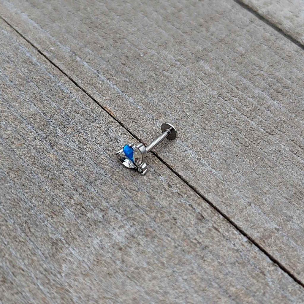 BodyCandy 16G 5/16 Blue Synthetic Opal Style Flower Labret Monroe Tragus — in-use photo