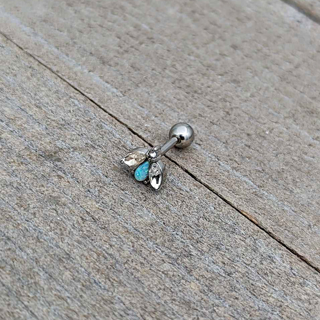 BodyCandy 16G 1/4 White Synthetic Opal Flower Cartilage Tragus Earring — in-use photo