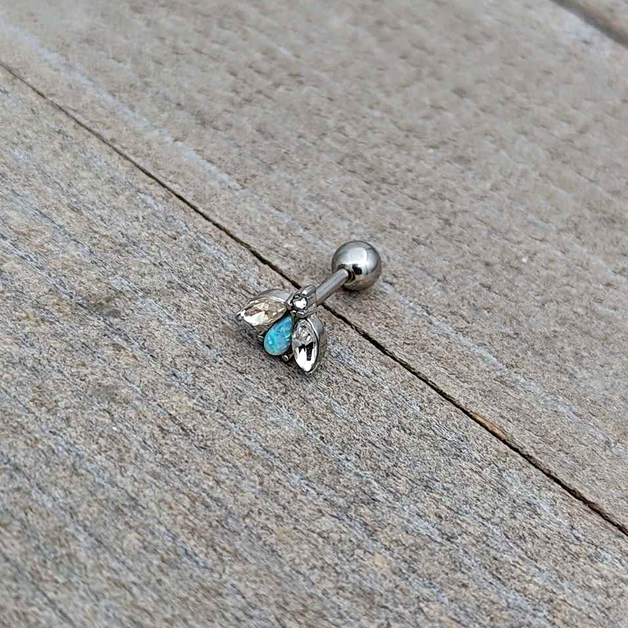 BodyCandy 16G 1/4 White Synthetic Opal Flower Cartilage Tragus Earring — in-use photo