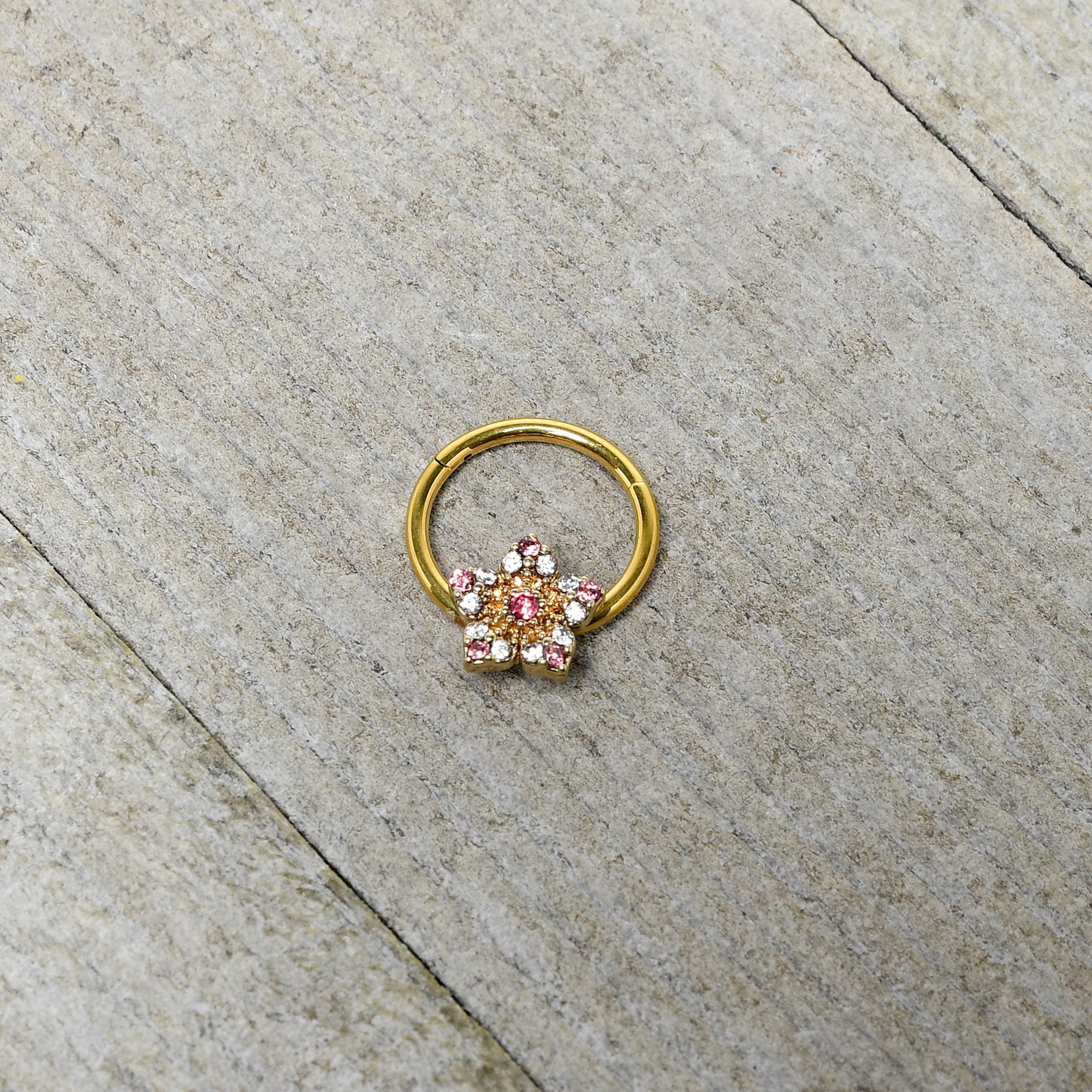 BodyCandy 16G 3/8 Pink Clear Gem Gold Tone Texture Star Hinged Segment Ring — side view