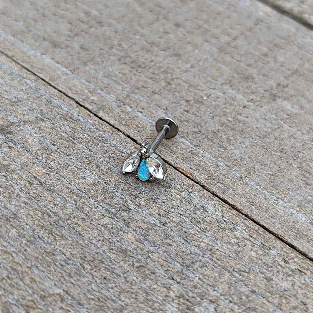 BodyCandy 16G 5/16 White Synthetic Opal Flower Labret Monroe Tragus — in-use photo