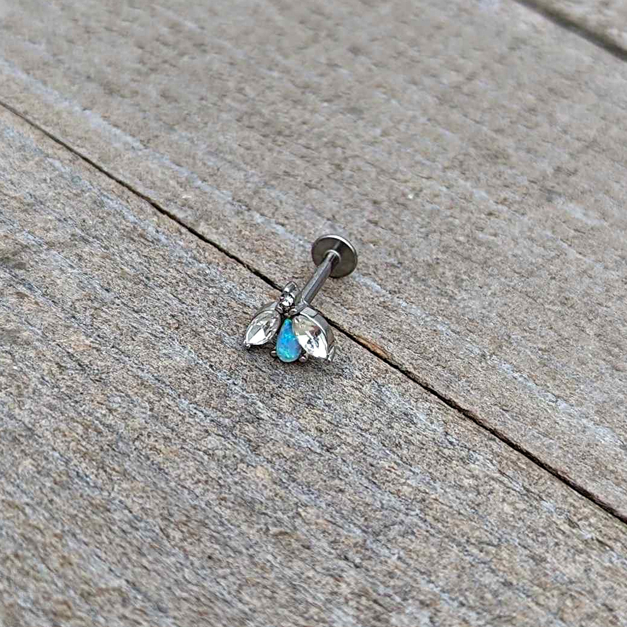 BodyCandy 16G 5/16 White Synthetic Opal Flower Labret Monroe Tragus — in-use photo