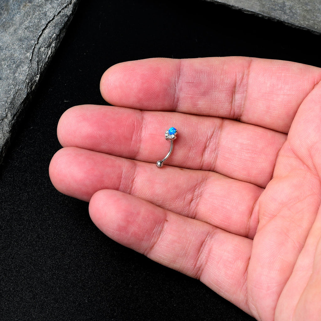 BodyCandy 16G 5/16 Clear Gem Blue Faux Opal Style Flower Curved Eyebrow Ring — in-use photo