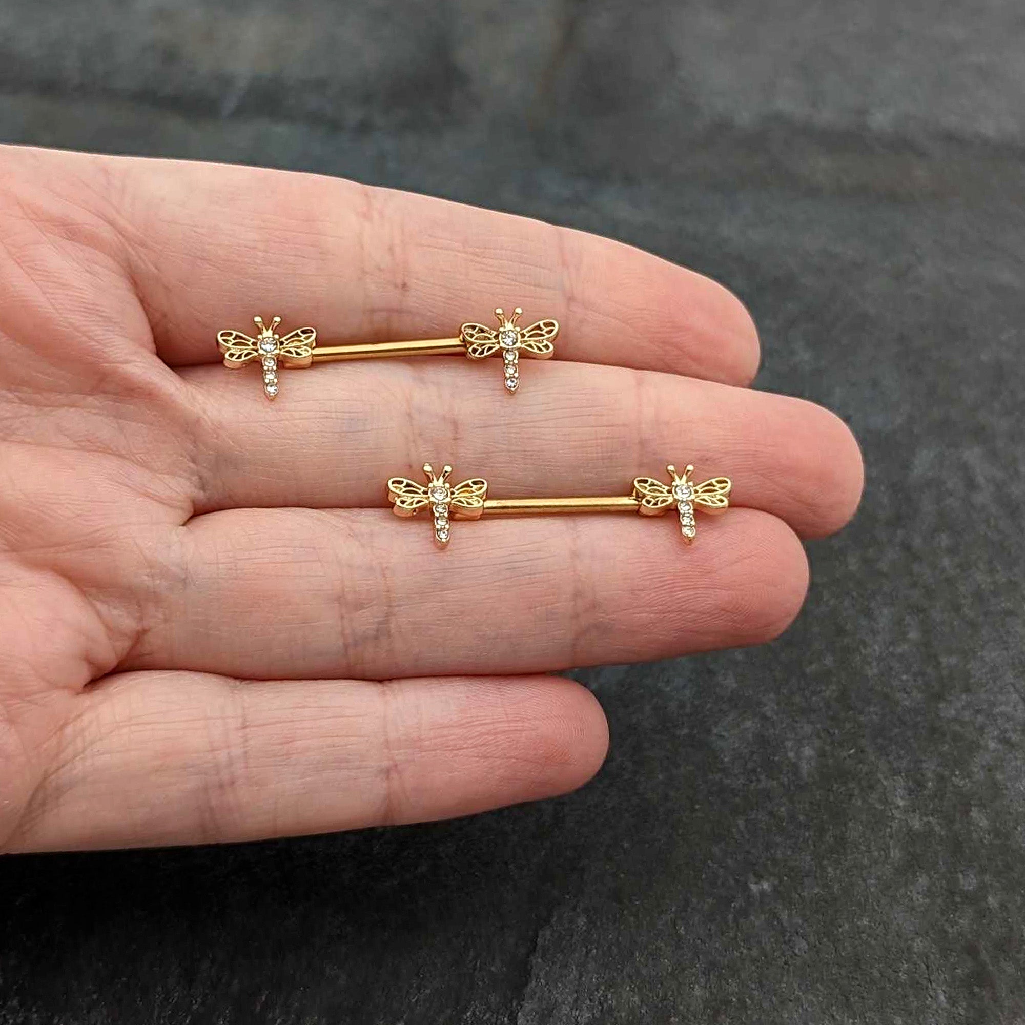 BodyCandy 14G 9/16 Clear Gem Gold Tone Flying Dragonfly Nipple Ring Set — in-use photo