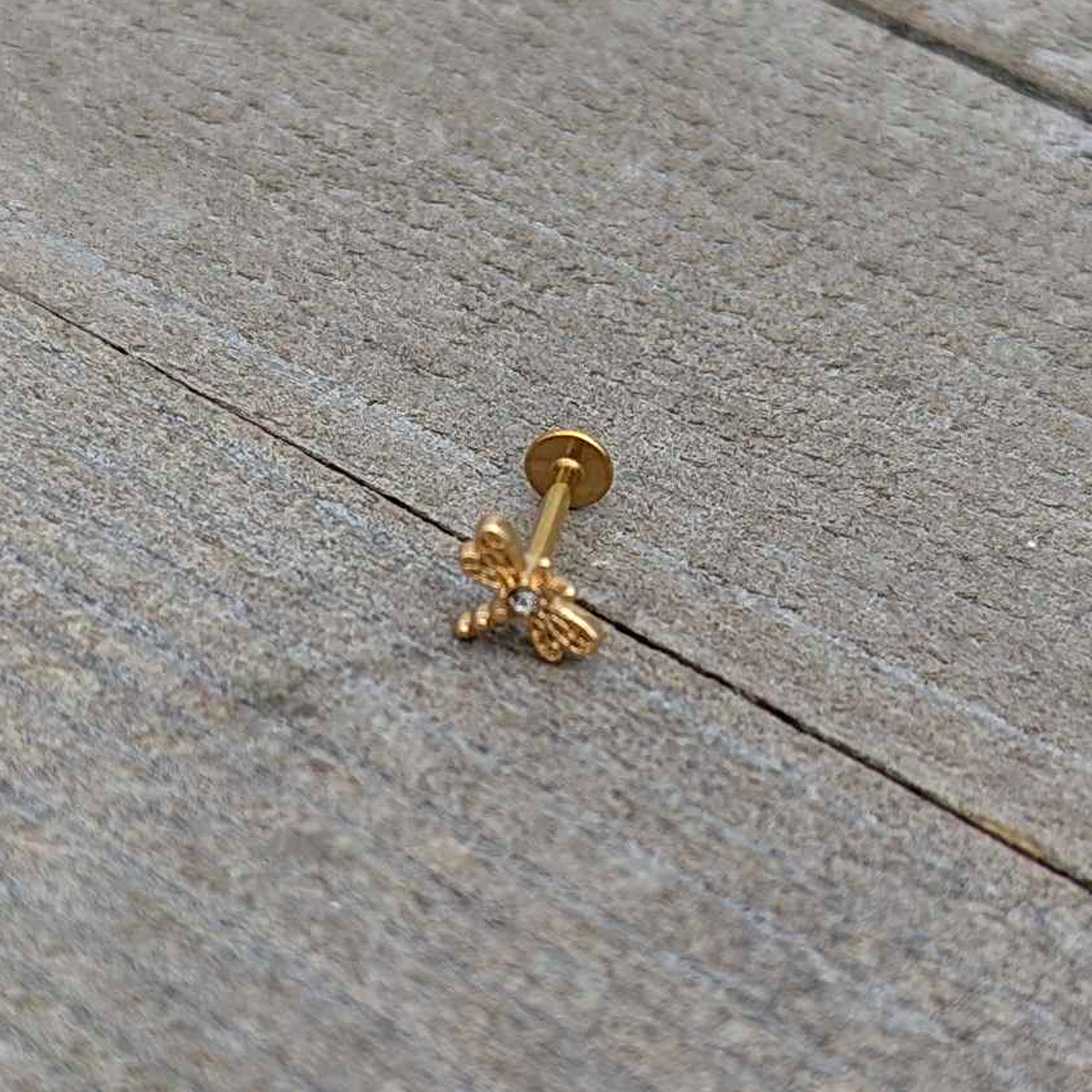 BodyCandy 16G 5/16 Clear Gem Gold Hue Flying Dragonfly Labret Monroe Tragus — in-use photo