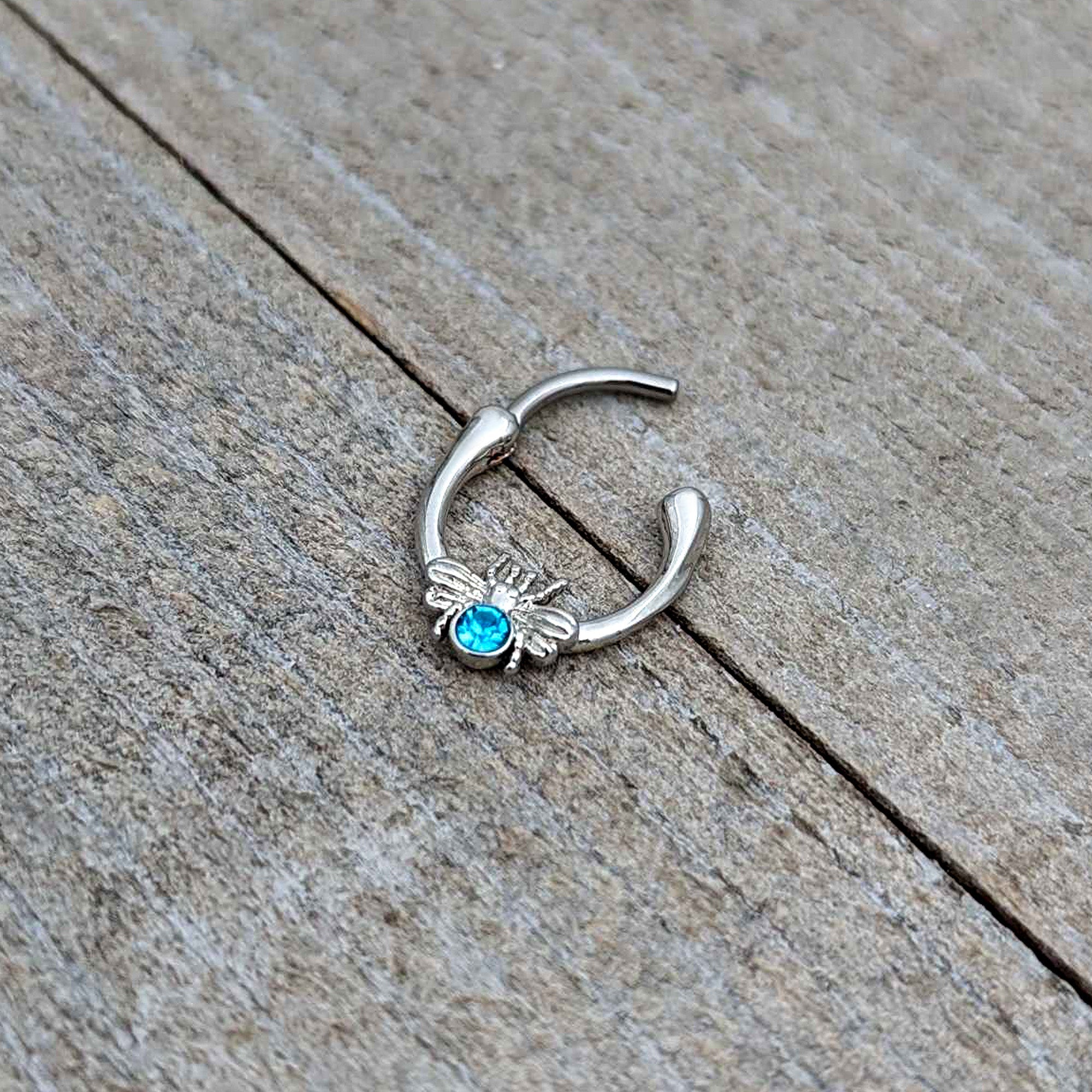 BodyCandy 16G 5/16 Blue Gem Ultra Fly Cartilage Clicker — in-use photo