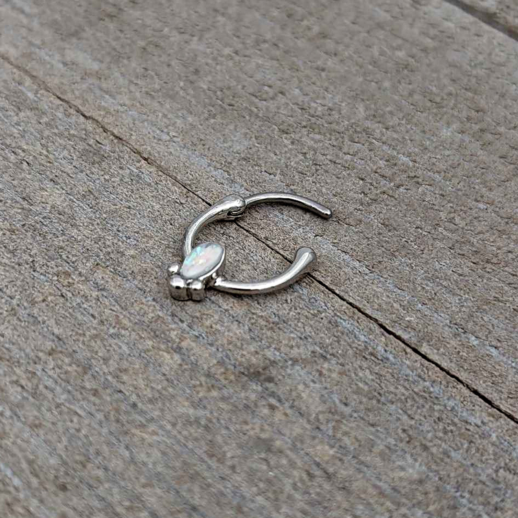 BodyCandy 16G 5/16 White Faux Opal Deco Oval Cartilage Clicker — in-use photo