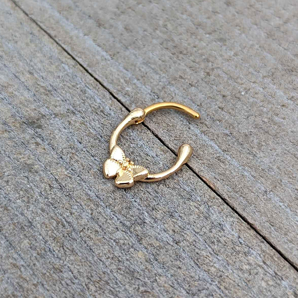 BodyCandy 16G 5/16 Gold Tone Simple Textured Butterfly Cartilage Clicker — in-use photo