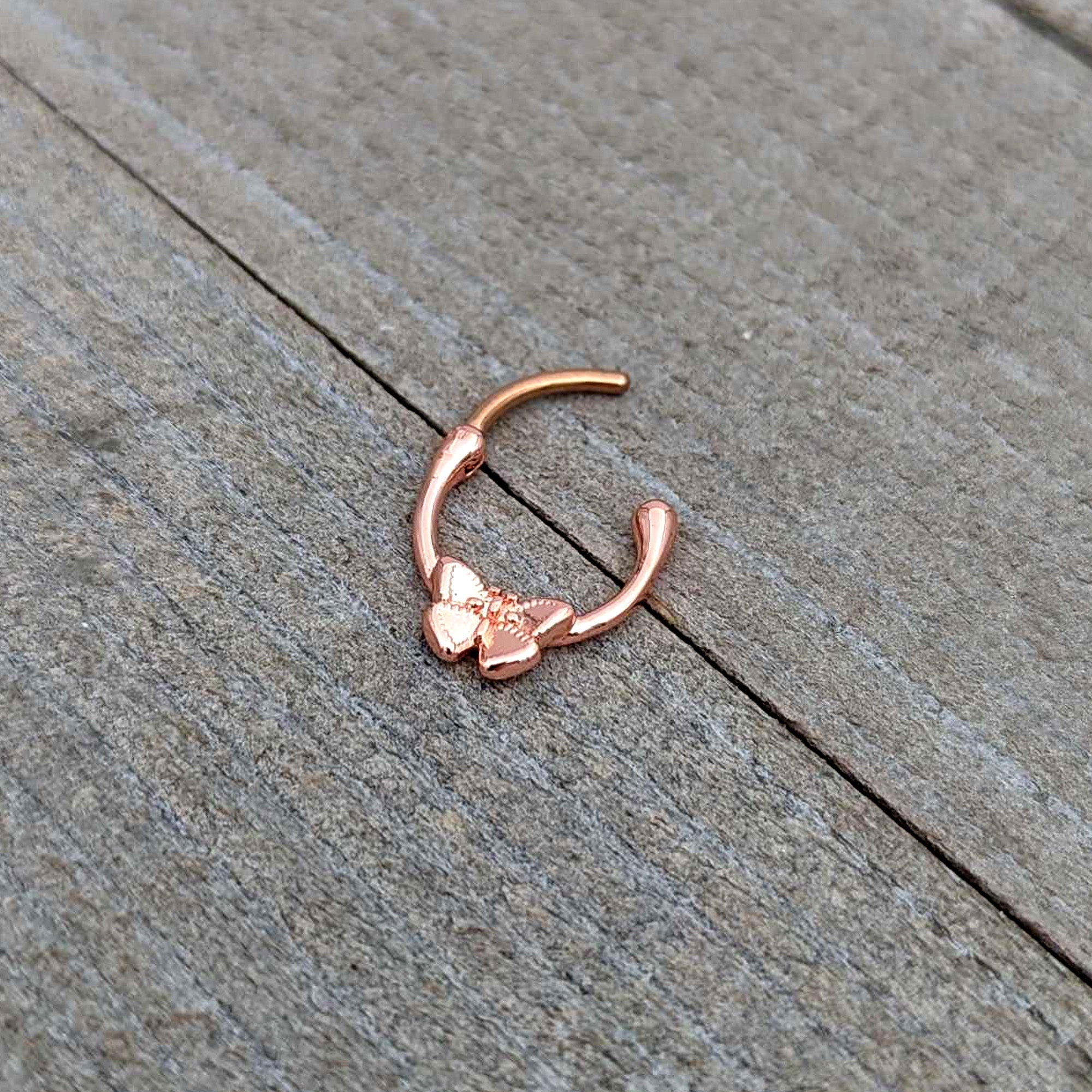 BodyCandy 16G 5/16 Rose Gold Tone Simple Textured Butterfly Cartilage Clicker — in-use photo
