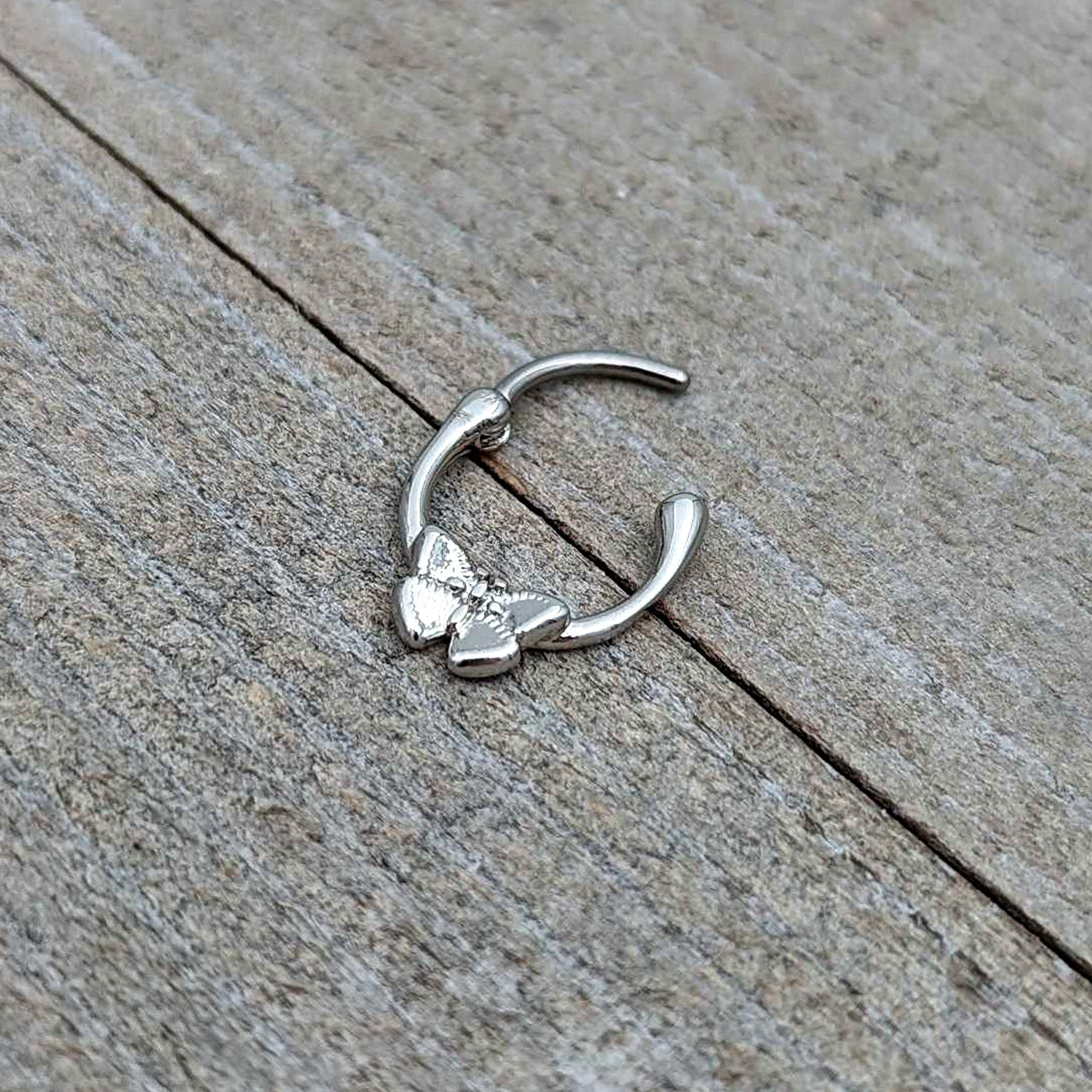 BodyCandy 16G 5/16 Simple Textured Butterfly Cartilage Clicker — in-use photo