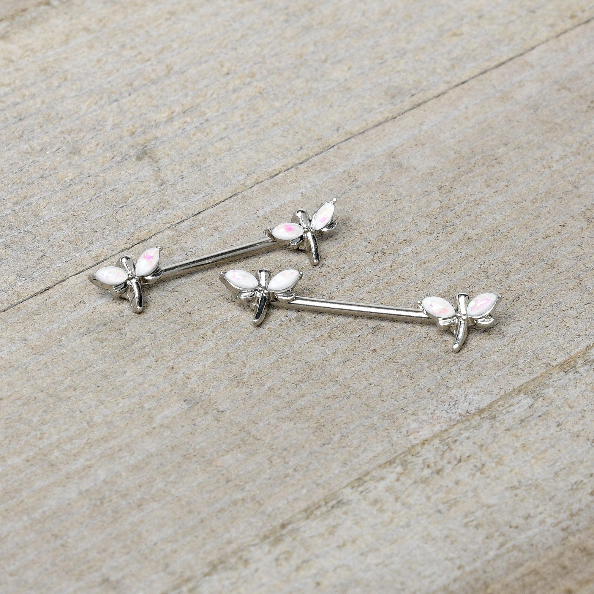 BodyCandy 14G 5/8 White Faux Opal Styled Dragonfly Barbell Nipple Ring Set — side view