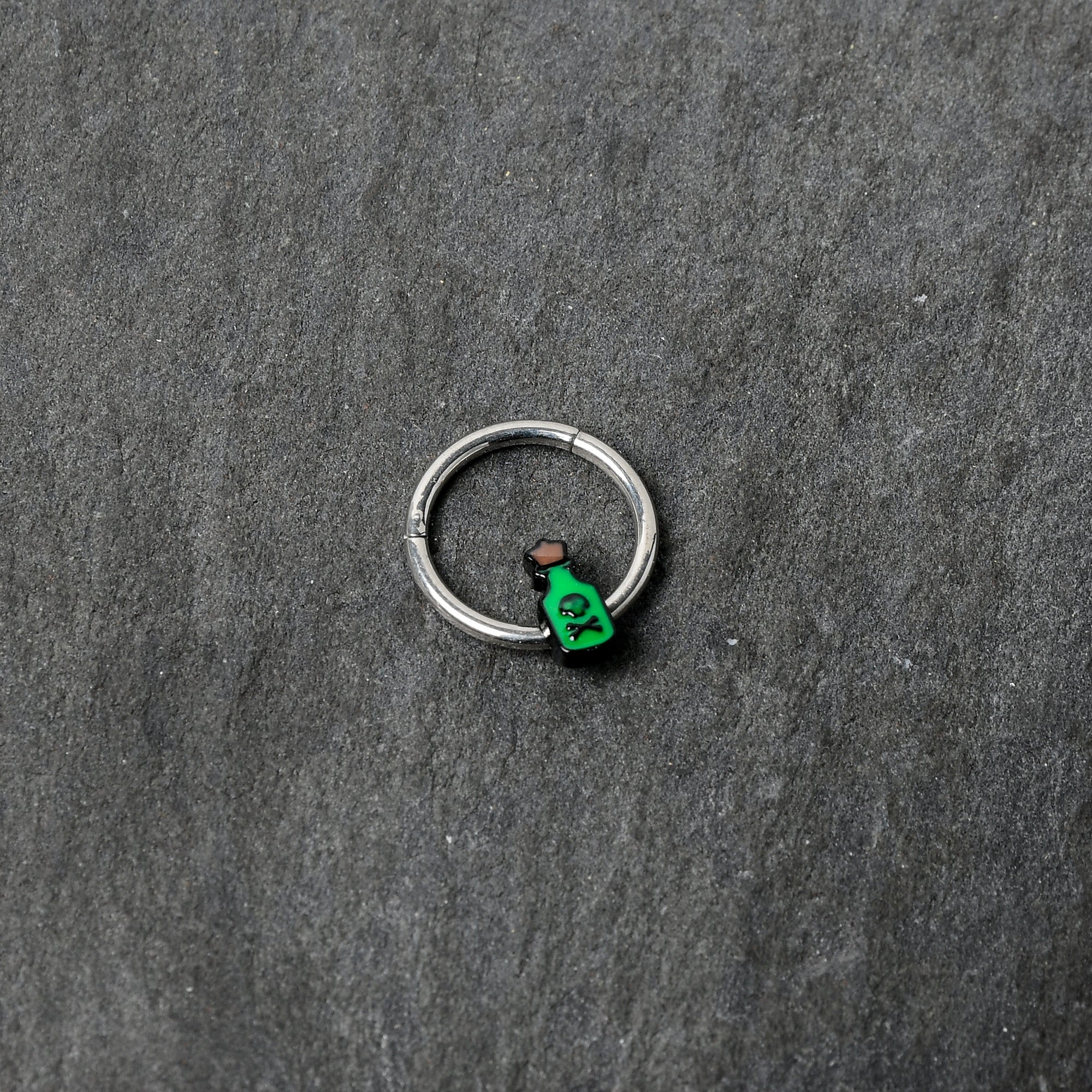 BodyCandy 16G 3/8 Poison Green Bottle Glow in the Dark Hinged Segment Ring — back view