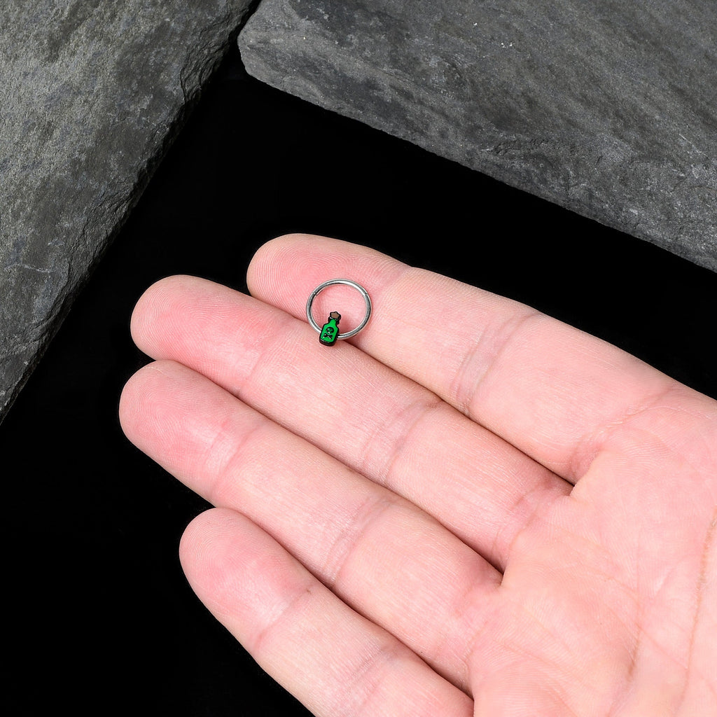 BodyCandy 16G 3/8 Poison Green Bottle Glow in the Dark Hinged Segment Ring — in-use photo