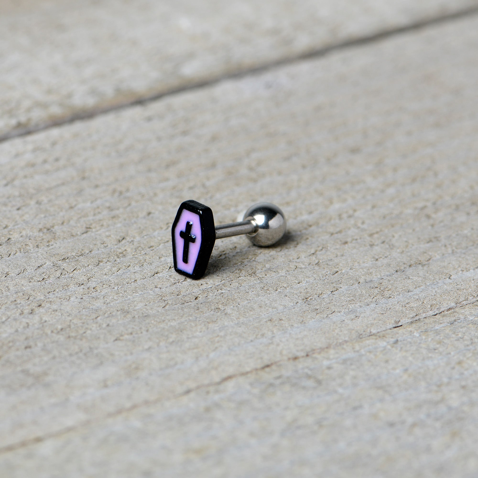 BodyCandy 16G 1/4 Creepy Coffin Lt Purple Glow in Dark Cartilage Earring — in-use photo