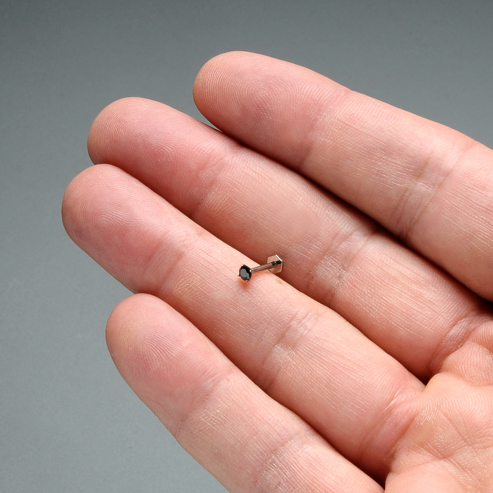 BodyCandy 16G 5/16 Black CZ Gem ASTM F-136 Implant Grade Titanium Hex End Labret Tragus — in-use photo