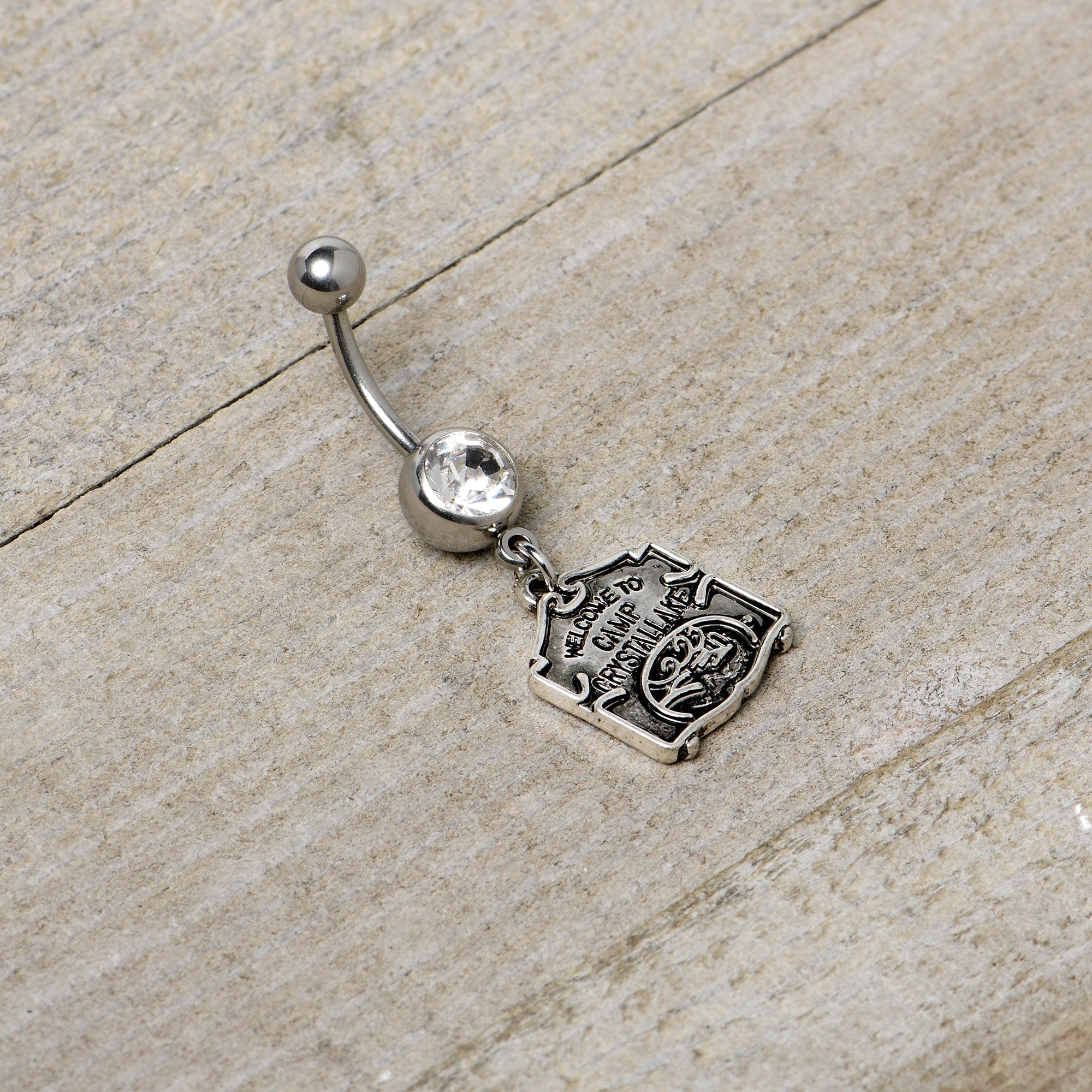 BodyCandy Officially Licensed Friday the 13th Clear Gem Camp Sign Dangle Belly Ring — back view