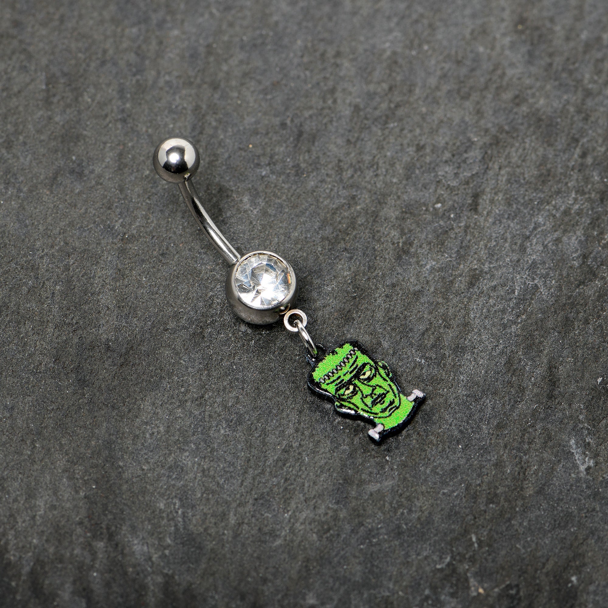 BodyCandy Clear Gem Frankenstein Head Green Glow in the Dark Dangle Belly Ring — back view