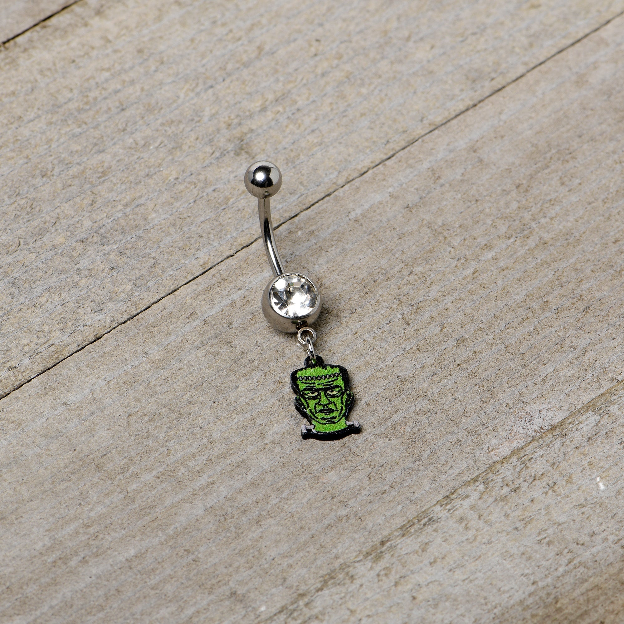 BodyCandy Clear Gem Frankenstein Head Green Glow in the Dark Dangle Belly Ring — alternative angle
