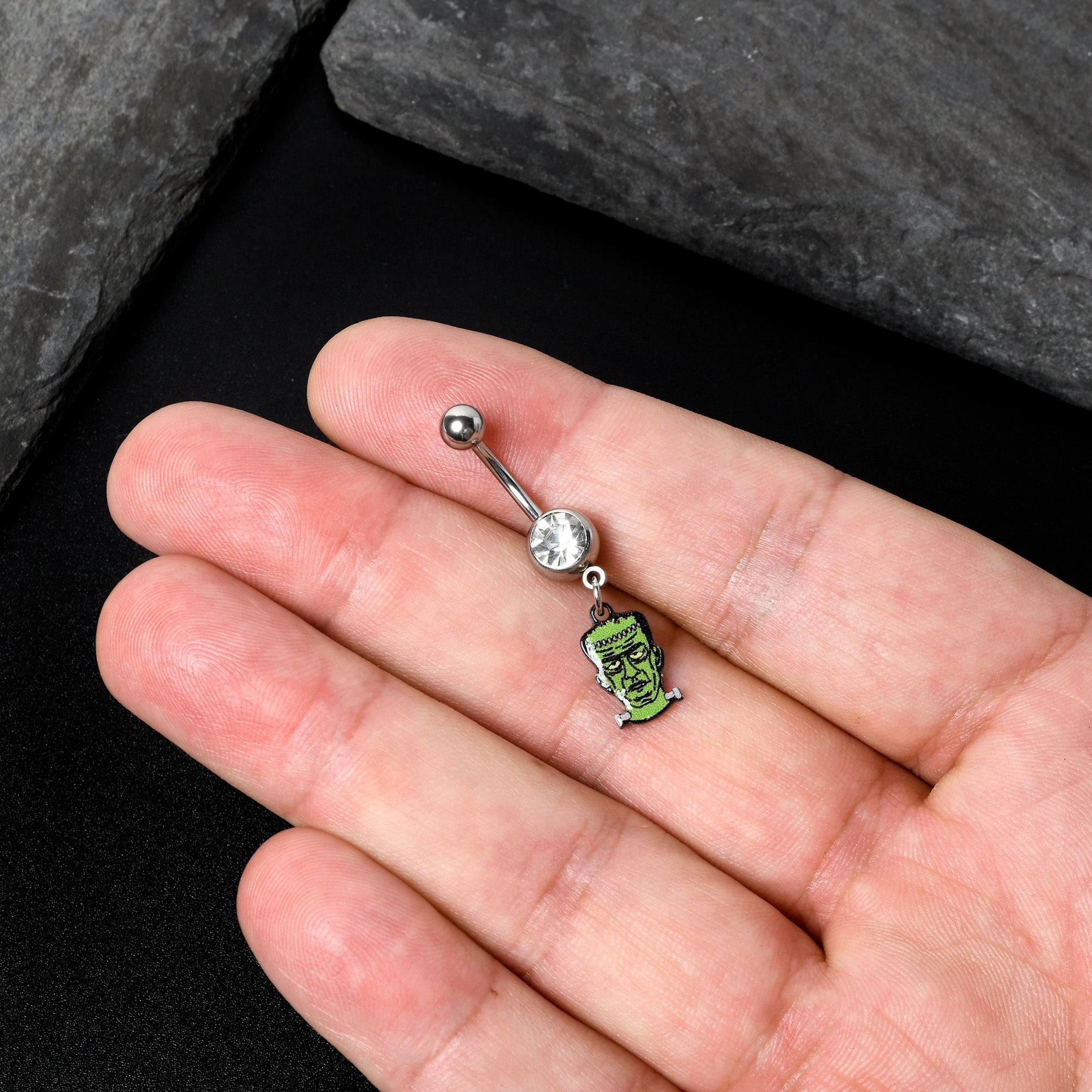 BodyCandy Clear Gem Frankenstein Head Green Glow in the Dark Dangle Belly Ring — in-use photo