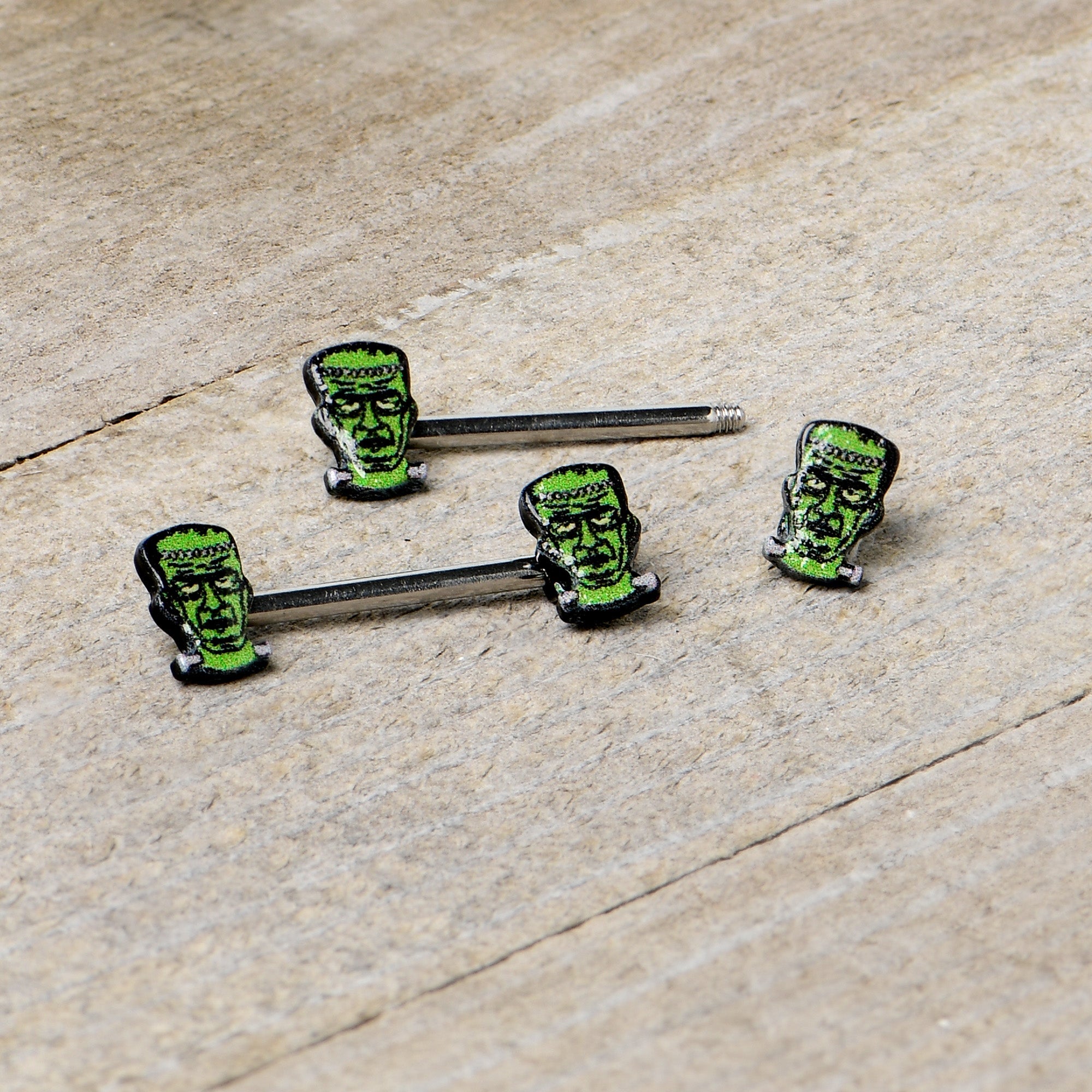 BodyCandy 14G 9/16 Frankenstein Head Green Glow in the Dark Nipple Ring Set — alternative angle
