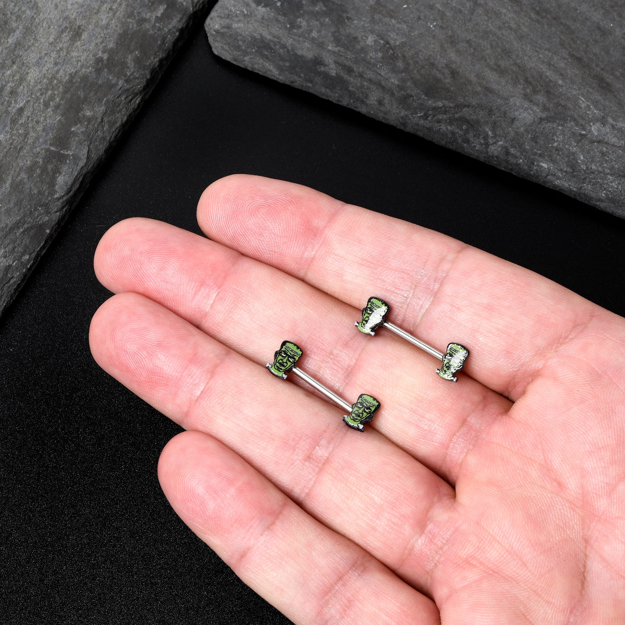 BodyCandy 14G 9/16 Frankenstein Head Green Glow in the Dark Nipple Ring Set — in-use photo