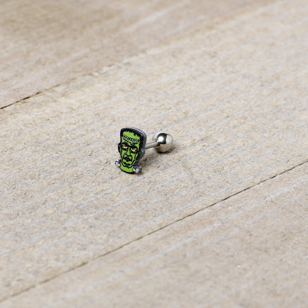 BodyCandy 16G 1/4 Frankenstein Head Green Glow in the Dark Cartilage Earring — in-use photo