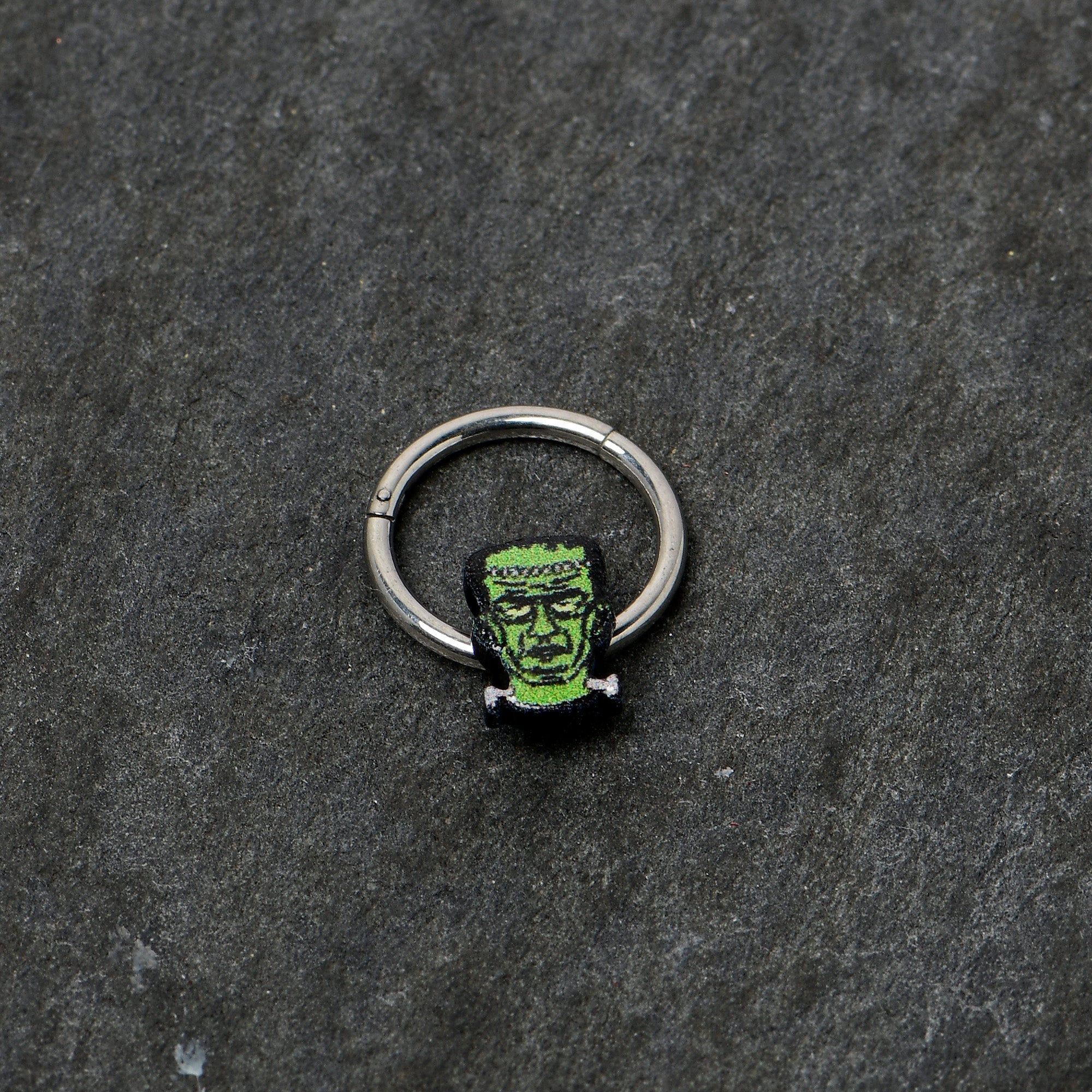 BodyCandy 16G 3/8 Frankenstein Head Green Glow in Dark Hinged Segment Ring — back view