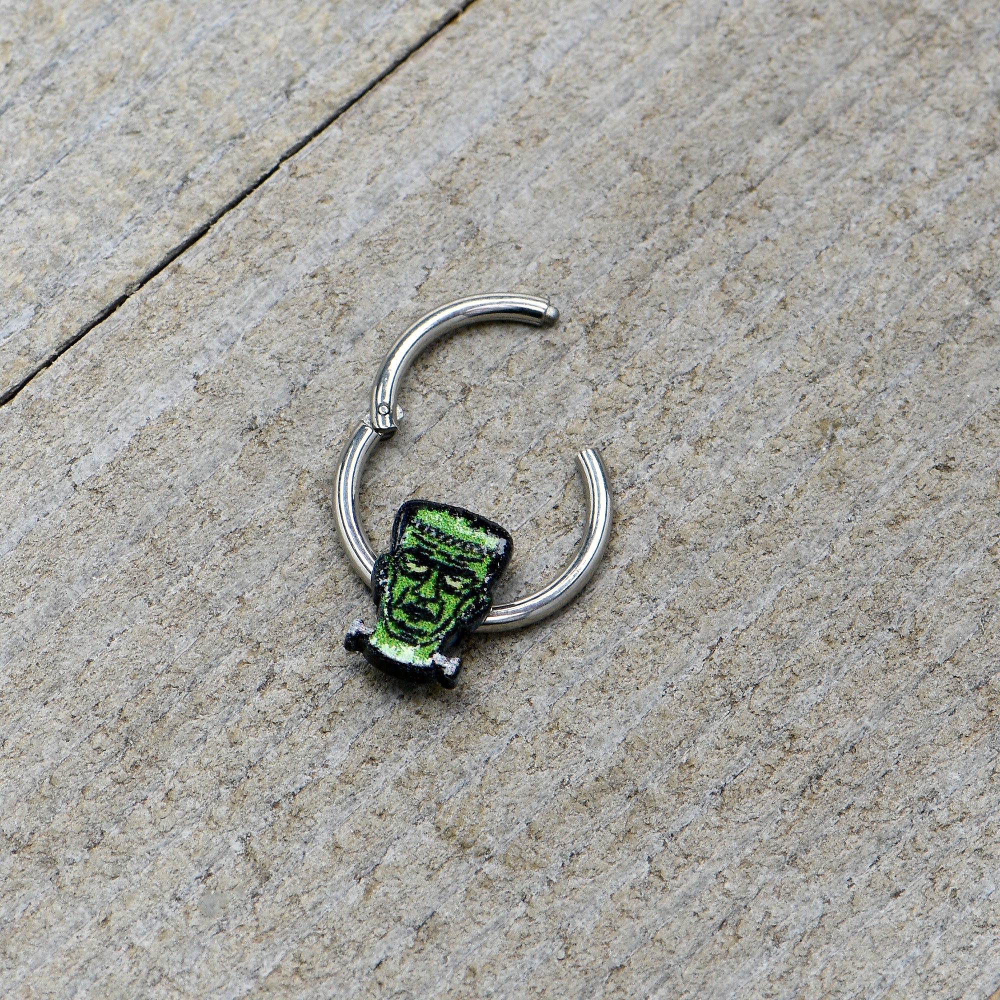 BodyCandy 16G 3/8 Frankenstein Head Green Glow in Dark Hinged Segment Ring — in-use photo