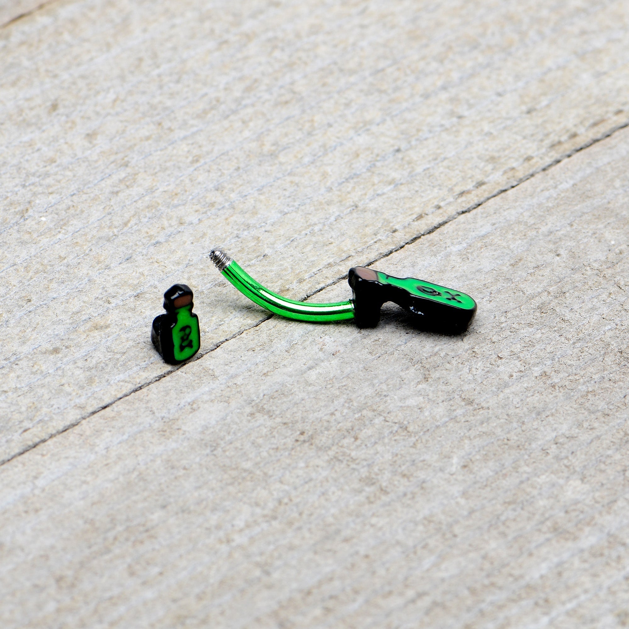 BodyCandy Green Poison Bottle Glow in the Dark Halloween Double Mount Belly Ring — in-use photo