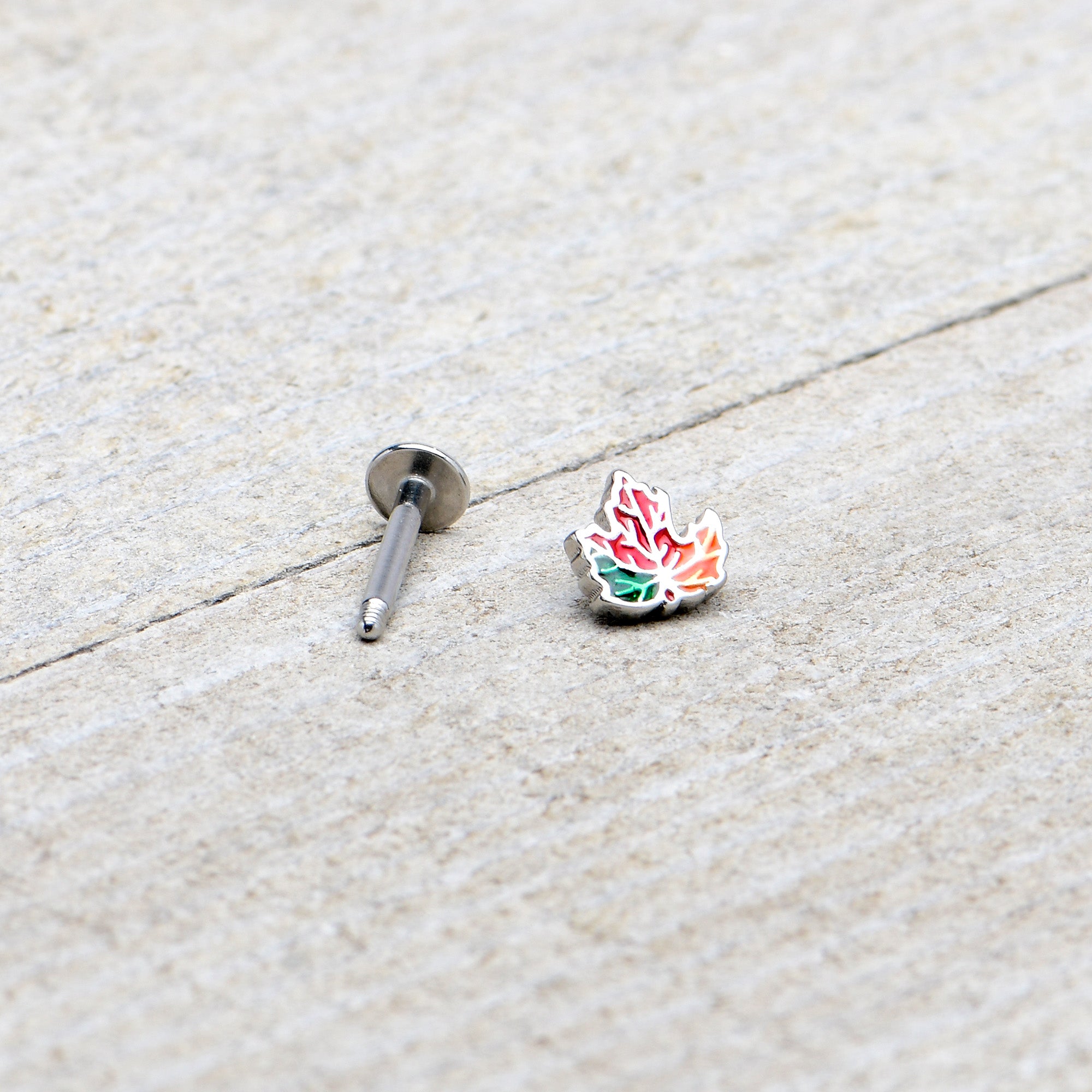 BodyCandy 16G 5/16 Autumn Tricolor Red Maple Leaf Labret Monroe Tragus — in-use photo