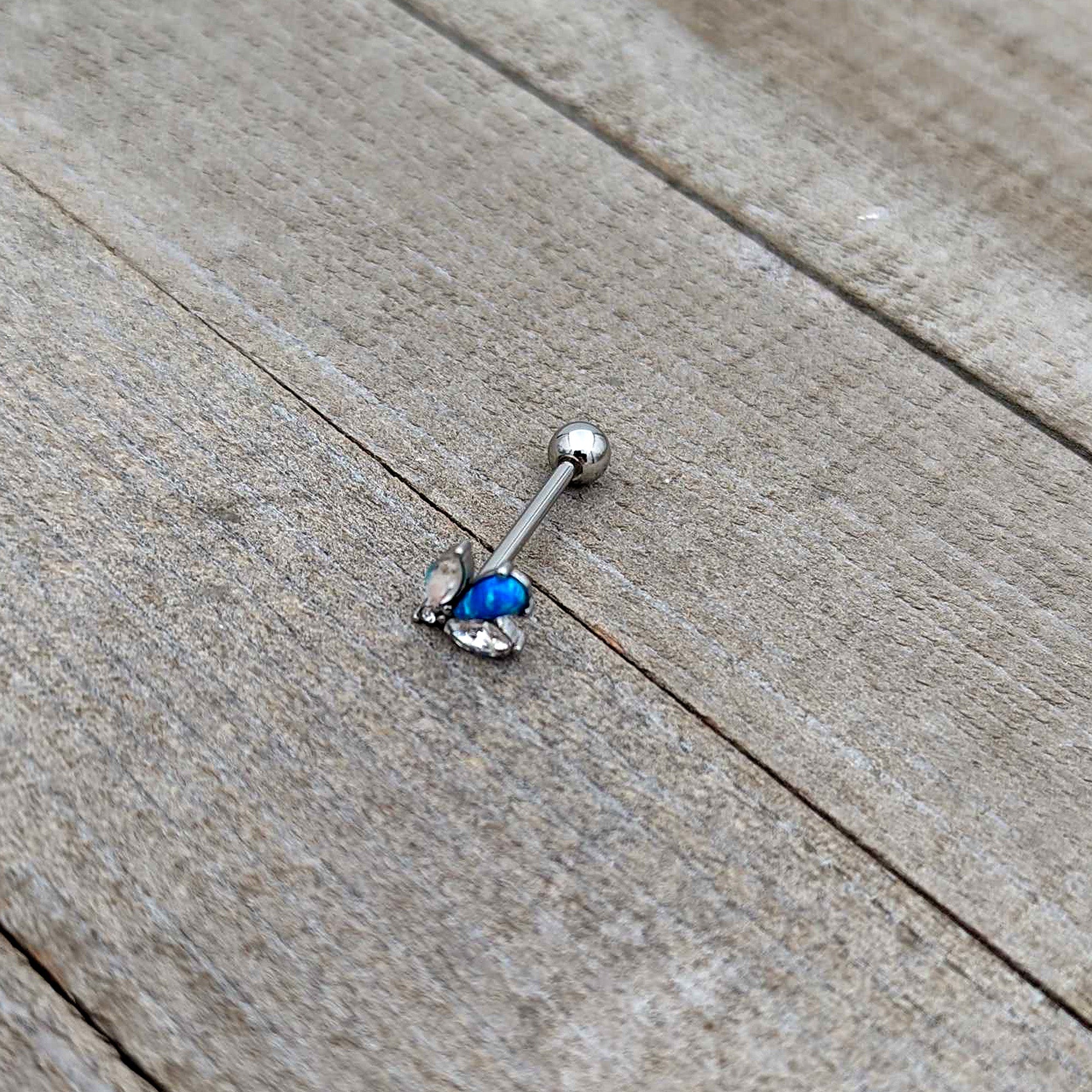 BodyCandy Blue Synthetic Opal Style Flower Barbell Tongue Ring — in-use photo