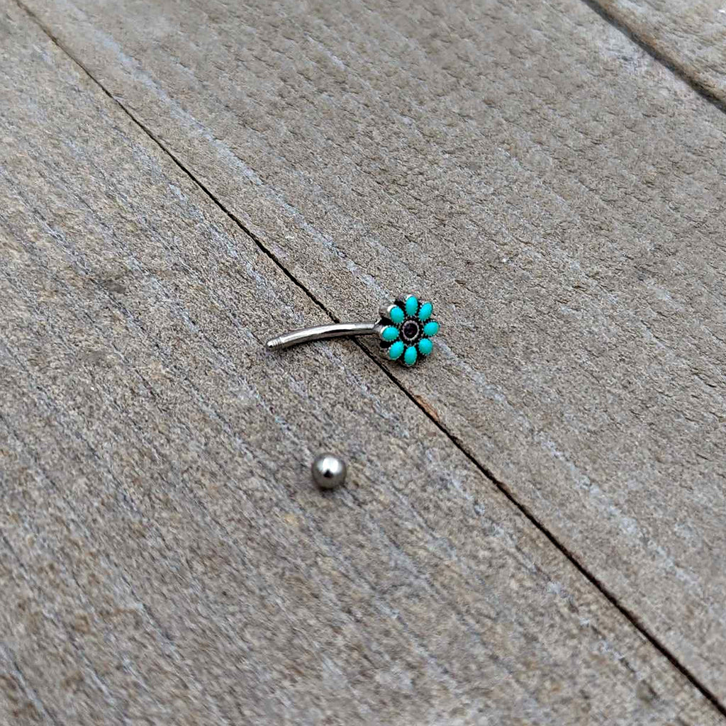 BodyCandy 16G 5/16 Blue Gem Flower Teal Petals Curved Eyebrow Ring — in-use photo