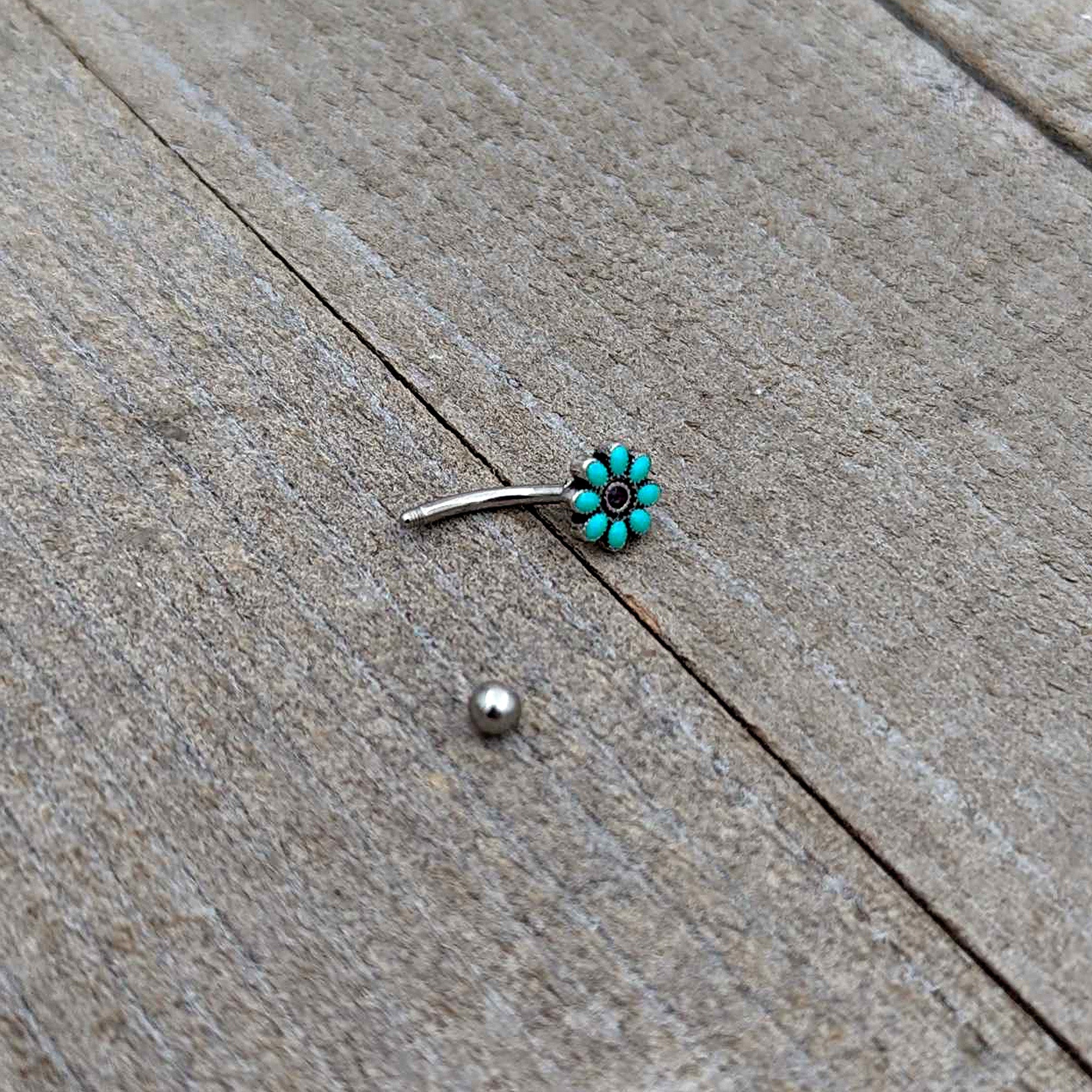 BodyCandy 16G 5/16 Blue Gem Flower Teal Petals Curved Eyebrow Ring — in-use photo
