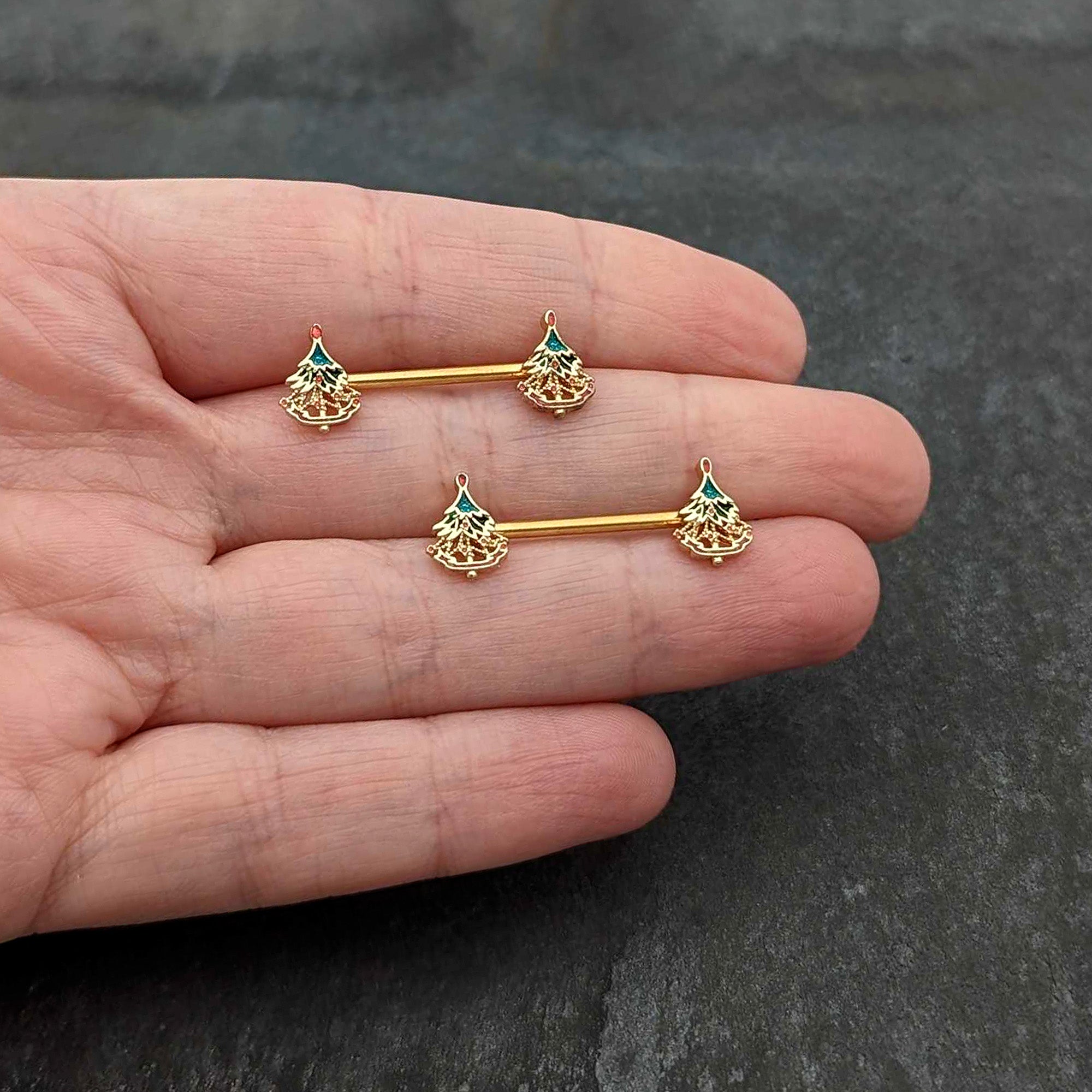BodyCandy 14G 9/16 Red Gem Gold Hue Deco Holiday Tree Barbell Nipple Ring Set — in-use photo