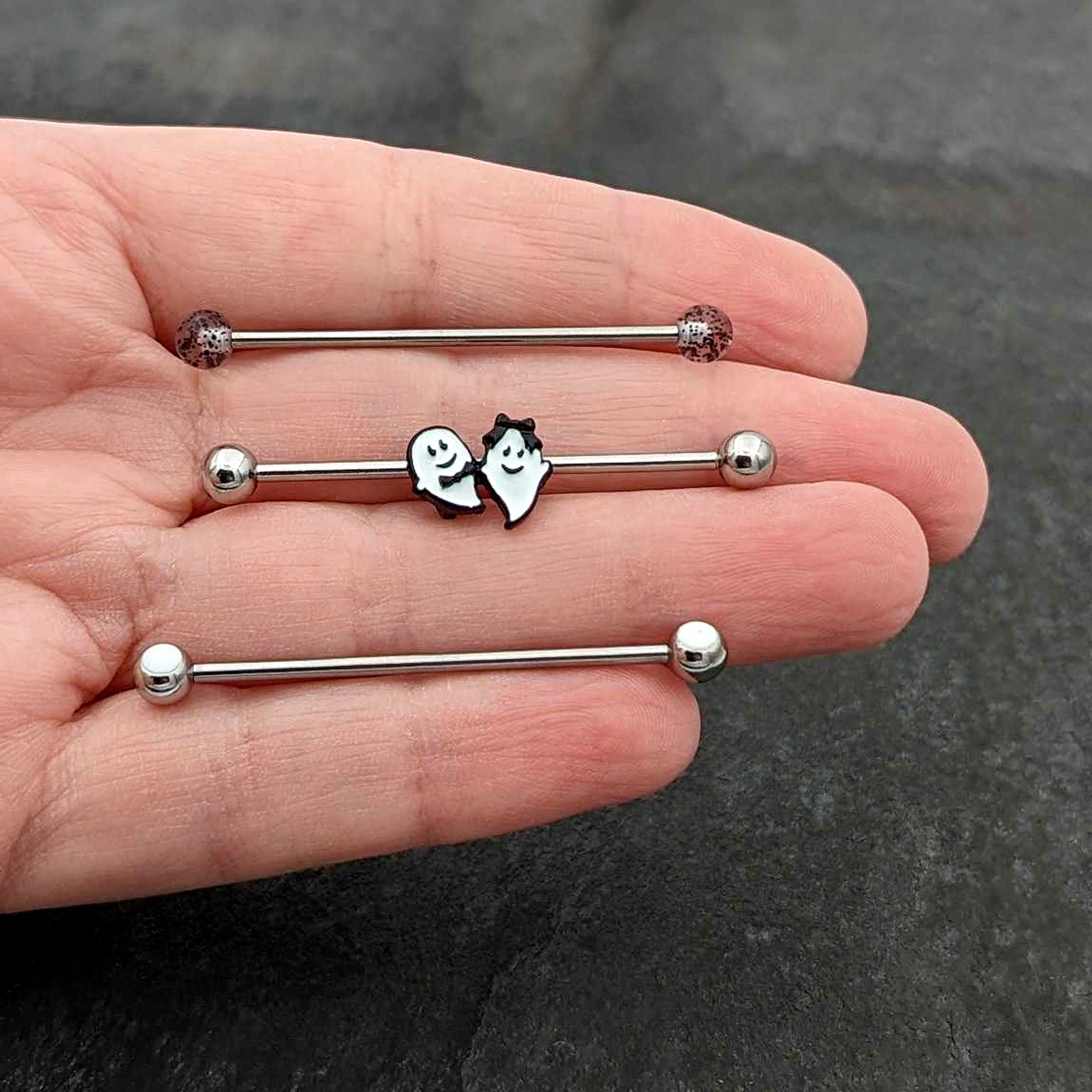 BodyCandy 14G Black Tie Ghosts Glow in Dark Industrial Barbell 38mm Set of 3 — in-use photo