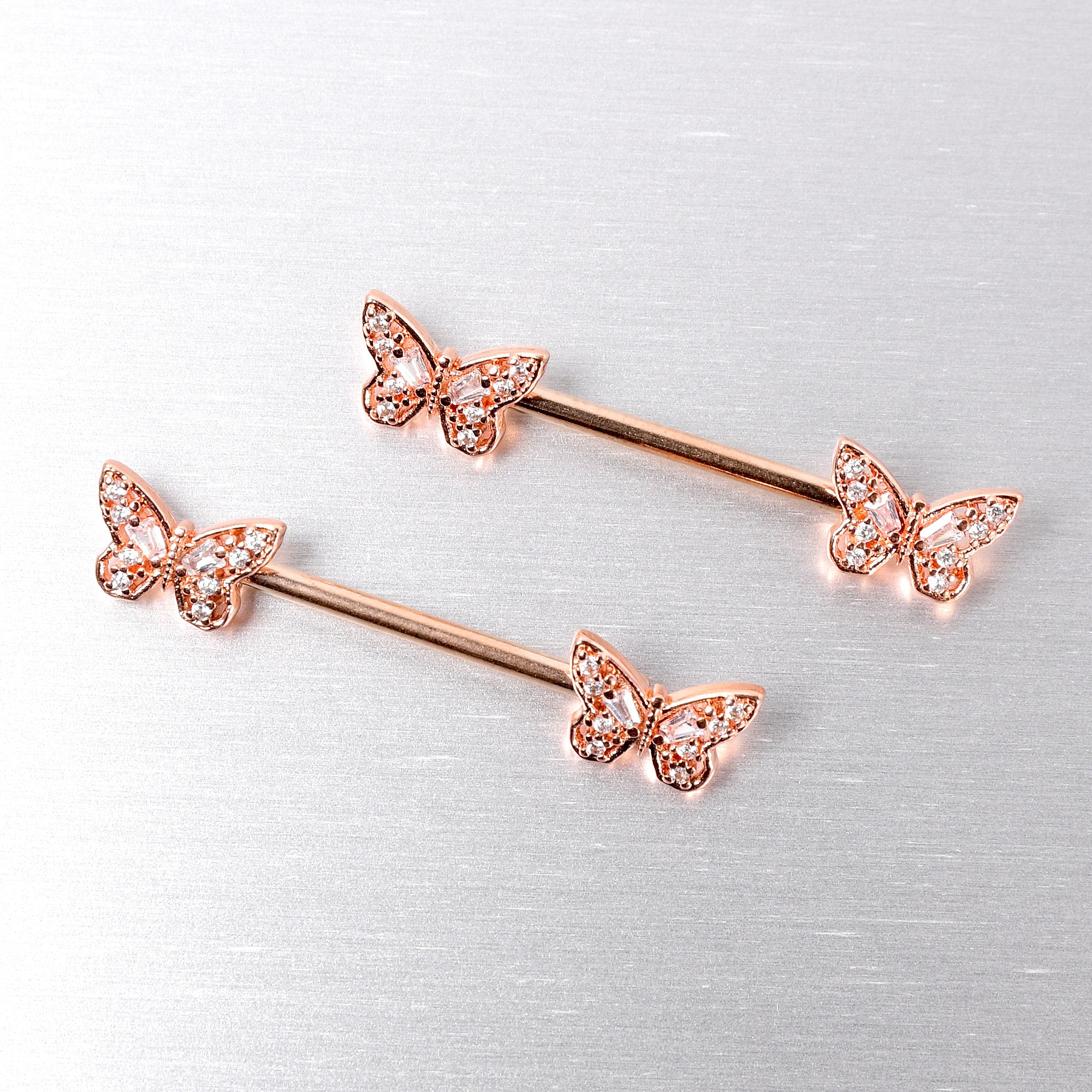BodyCandy 14G 9/16 Clear Gem Rosy Tone Baroque Butterfly Nipple Ring Set — side view