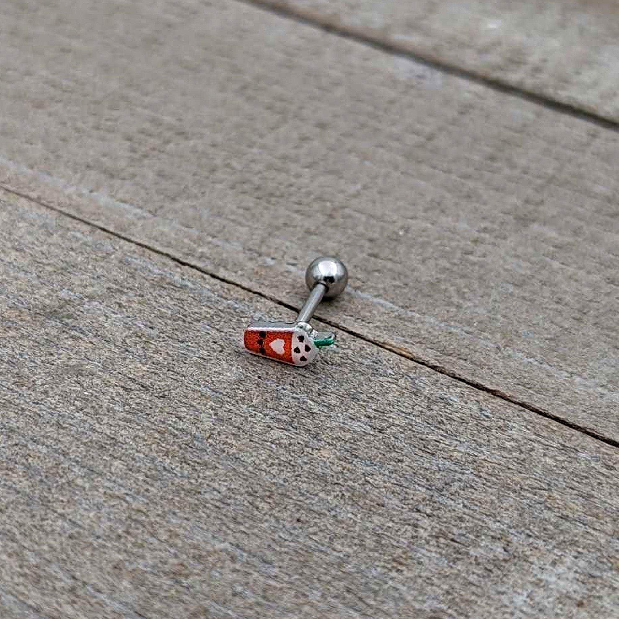BodyCandy 16G 5/16 Sweet Pumpkin Frappe Autumn Cartilage Tragus Earring — in-use photo
